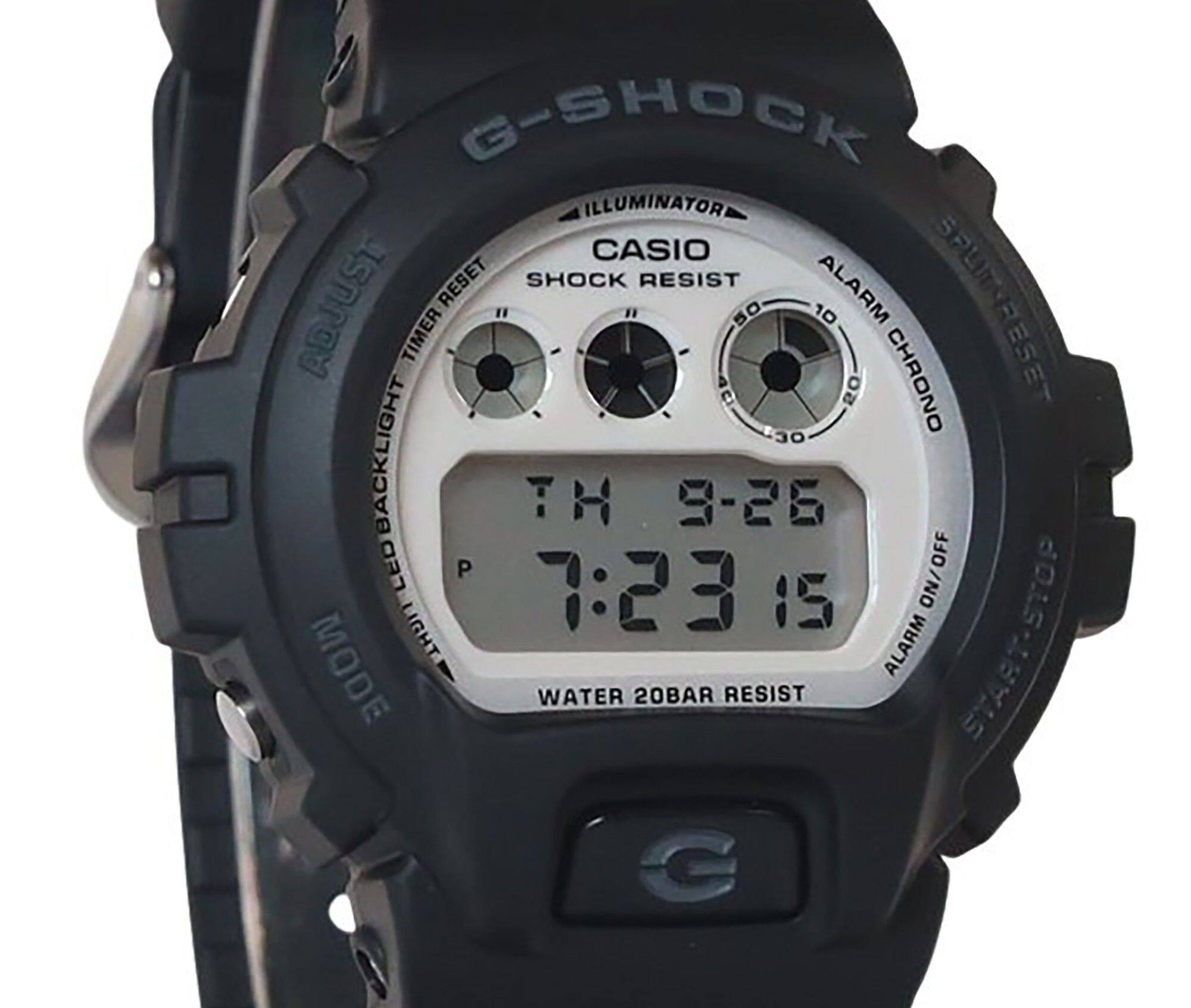 G-SHOCK ILLUMINATOR CASIO SHOCK RESIST ALARM ADJUST TIMER 50 10 CHRONO : ESET Ci 50 30 BACKLIGHT TH 9-26 03n P OFF 7:23 15 ON/OFF LIGHT ALARM START-STOP MODE WATER 20BAR RESIST