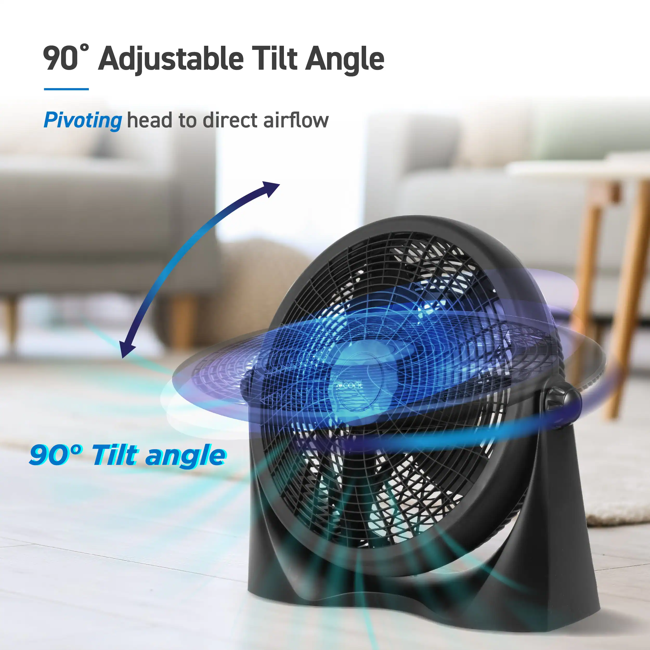 The image features a black fan with a 90-degree adjustable tilt angle. The fan has a pivoting head that directs airflow, making it an efficient and versatile appliance for various settings. The fan is placed on a wooden floor, and there is a couch in the background.