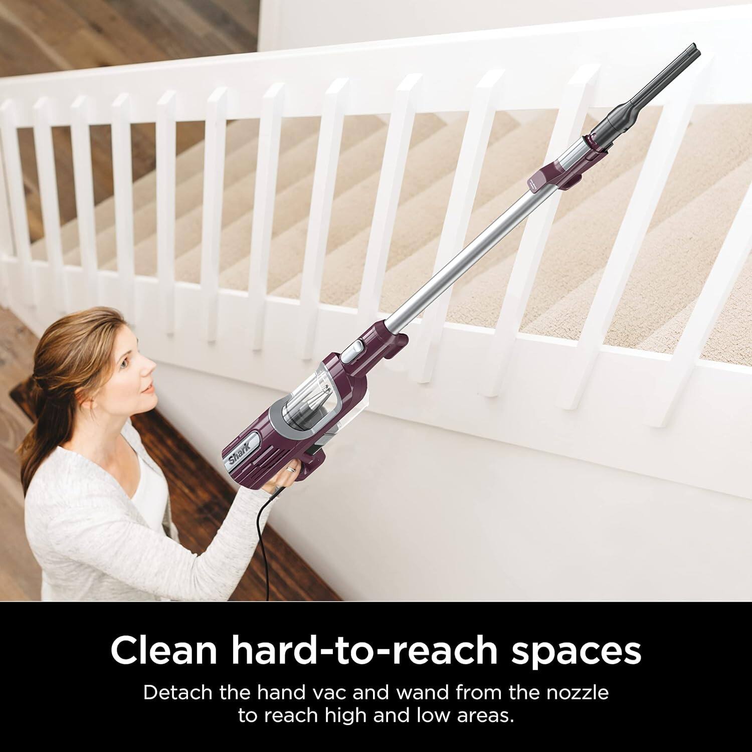 Clean hard-to-reach spaces  
Detach the hand vac and wand from the nozzle to reach high and low areas.