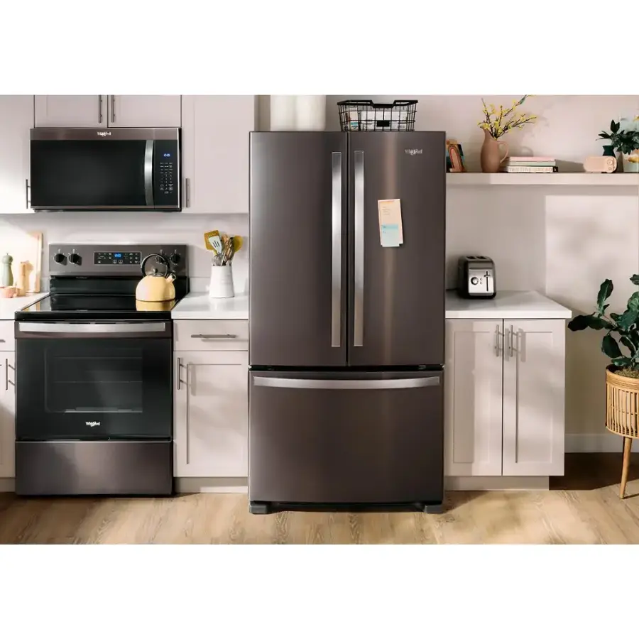 The text on the image is not related to the content of the image, which features a kitchen with a refrigerator, oven, and microwave.