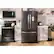 The text on the image is not related to the content of the image, which features a kitchen with a refrigerator, oven, and microwave.