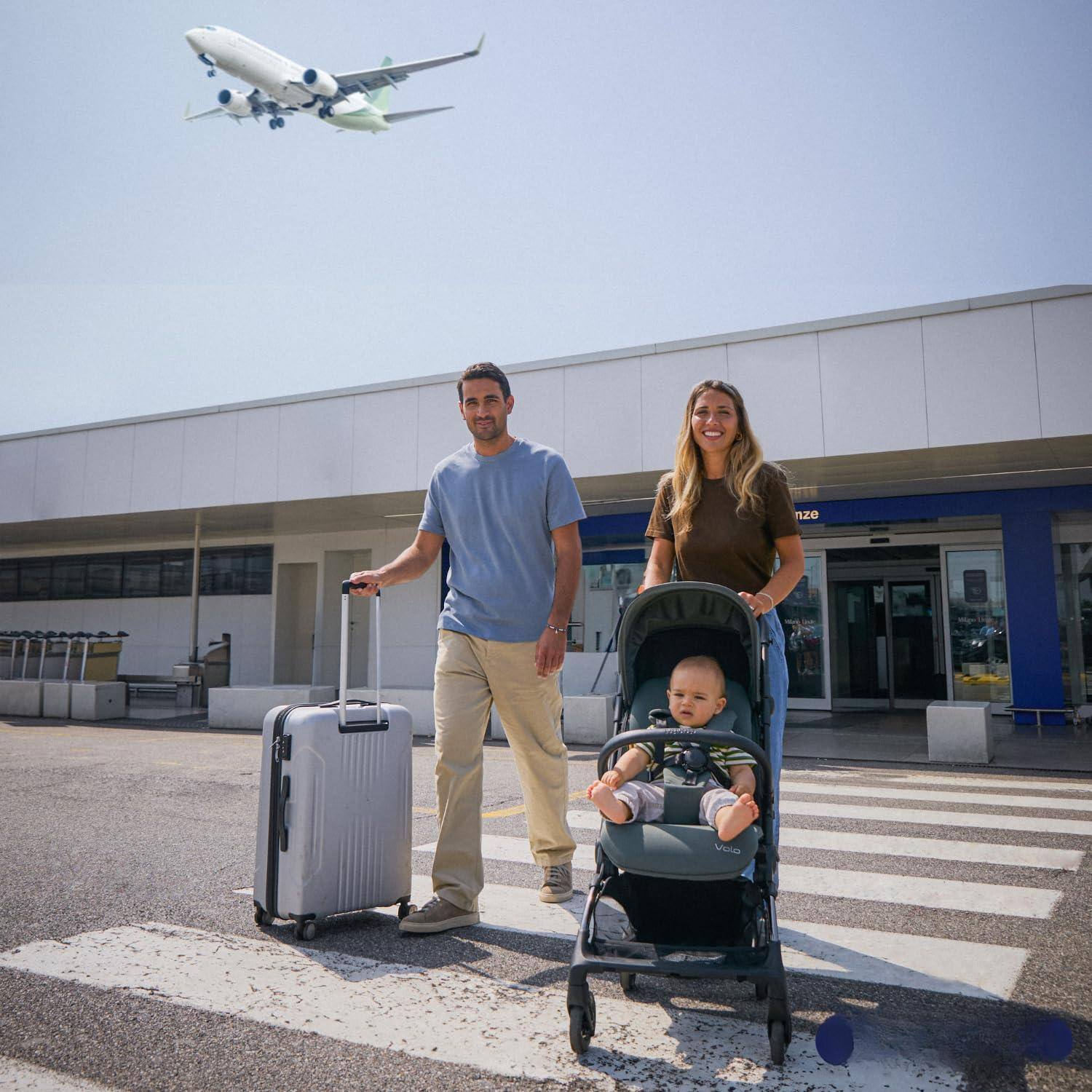 The text on the image is:

- "Vola" (on the stroller)
- "nize" (partially visible on the building)