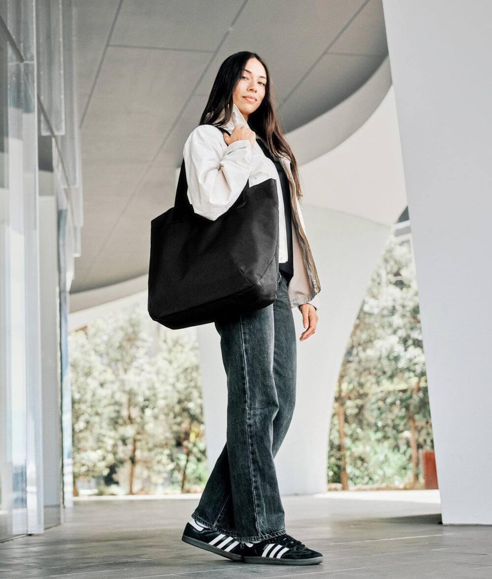 Back. ALPAKA - Elements Tote 20L Laptop Tote Bag with Padded 16" Sleeve,Open Top with Magnetic Closure - Black Axoflux 210D.