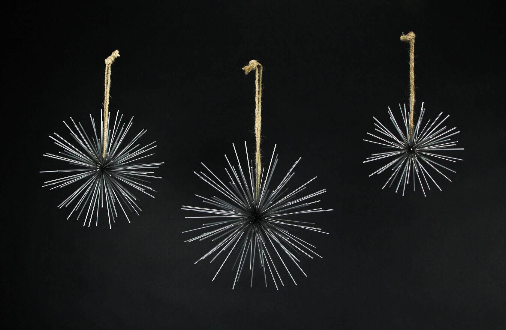 Alt View 1. Zeckos - Silver Metal Bursting Star Decorative Hanging Ornaments Set of 3 Rope Hangers - Silver.