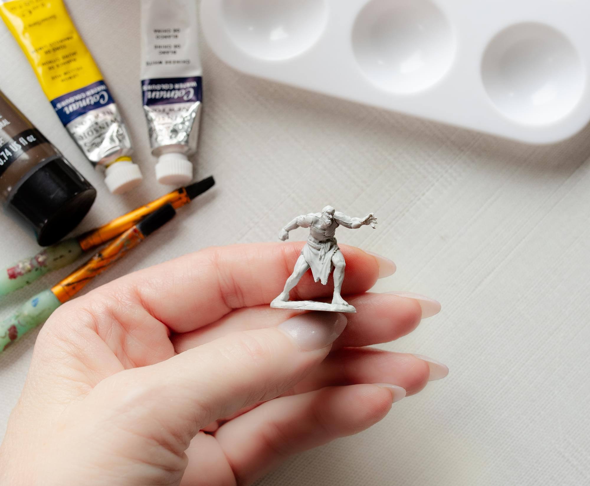 The text in the image reads:

"AIL F fl O US J.14 GR Cotman Cotman DOSNEM"