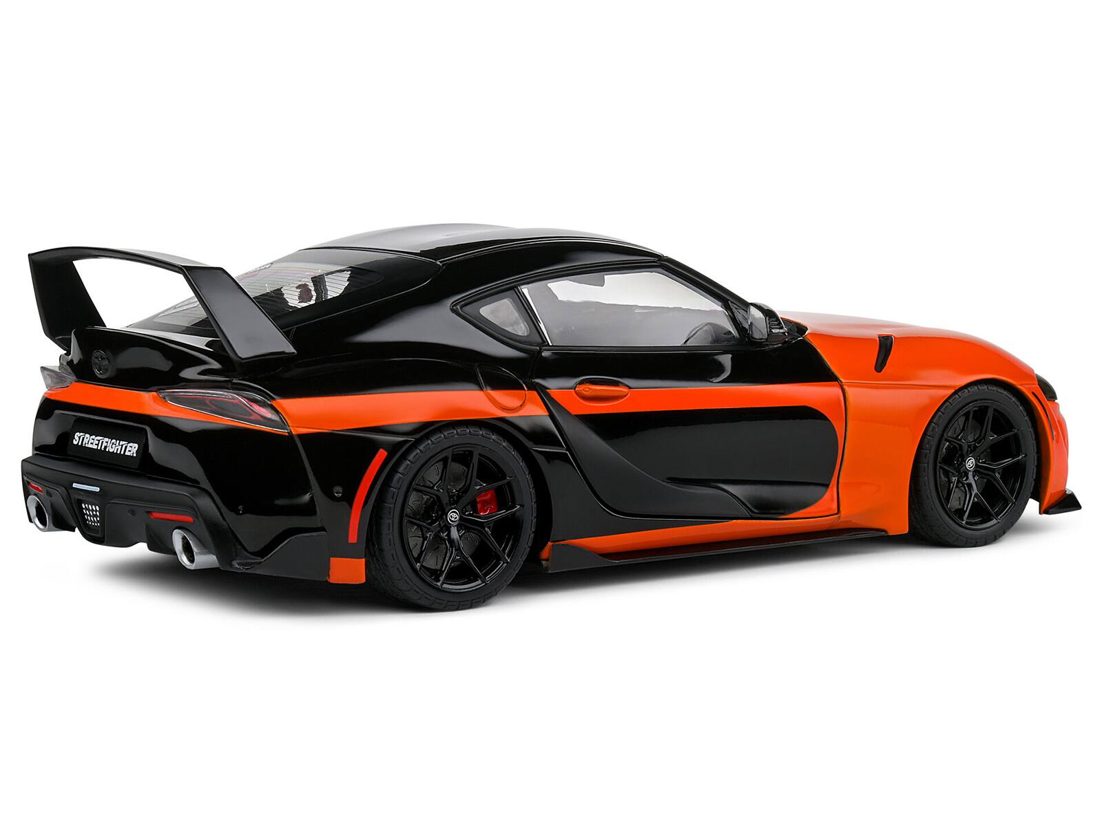 Back. Solido - 2024 Toyota GR Supra "StreetFighter" Orange and Black 1/18 Diecast Model Car by Solido - Orange and Black.