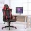 The image shows a black and red chair with the brand name "Sopulus" on it. The chair is placed in front of a desk, which has a computer monitor on it. The desk is situated near a window, providing natural light to the workspace. The chair is designed for comfort and ergonomics, making it an ideal choice for extended periods of work or gaming.