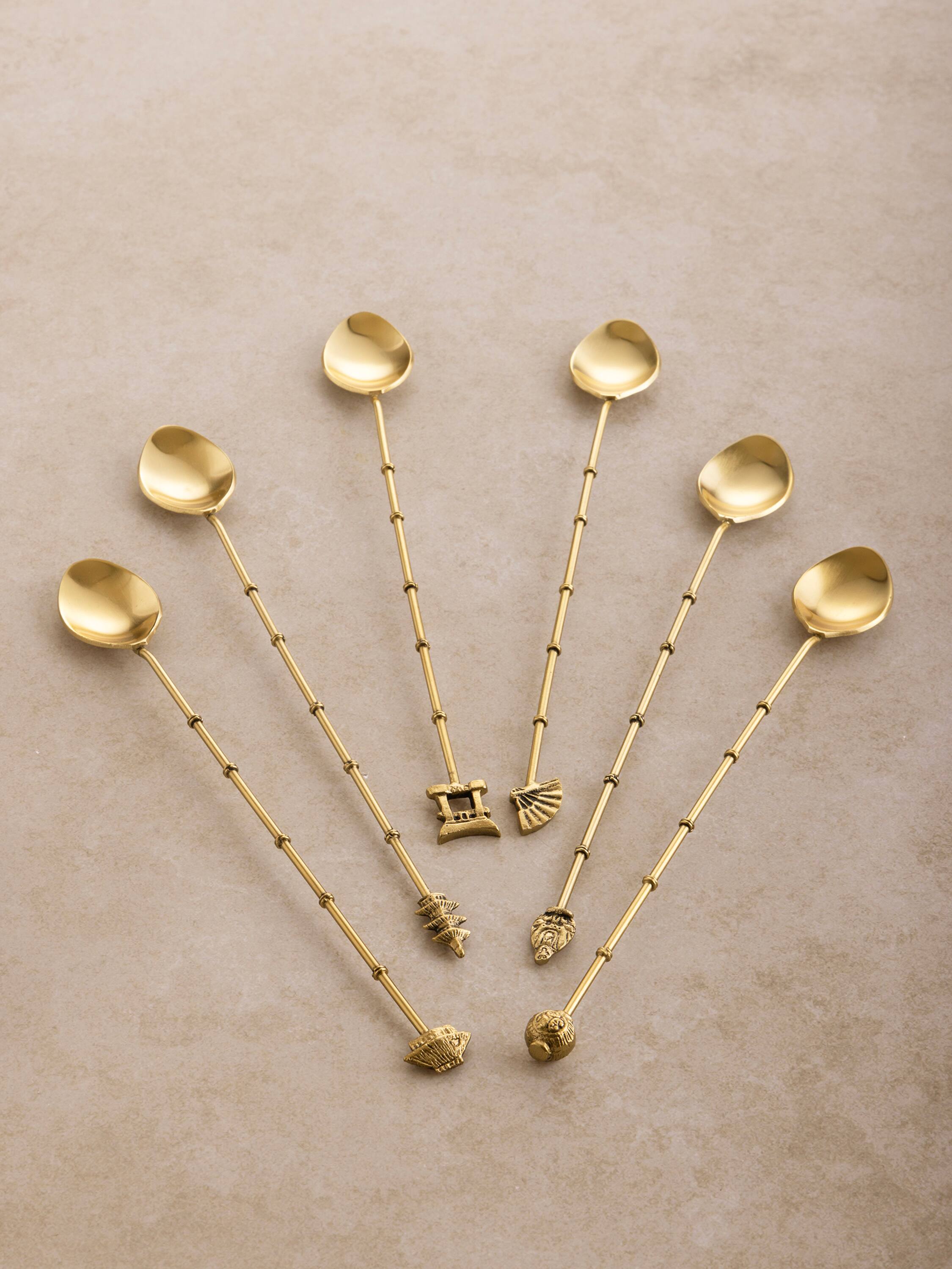 Left. GAURI KOHLI - Magnolia Cocktail Stirrers - Antique matte gold.