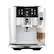 The image features a Jura 9 Twin espresso machine, which is a modern and sleek coffee maker. It is designed to make both coffee and milk, as evidenced by the presence of a milk dispenser. The machine has a large screen on the front, which displays various options for coffee and milk, allowing users to customize their beverages. The espresso machine is ready to serve a hot beverage, with a cup of coffee or milk already prepared.