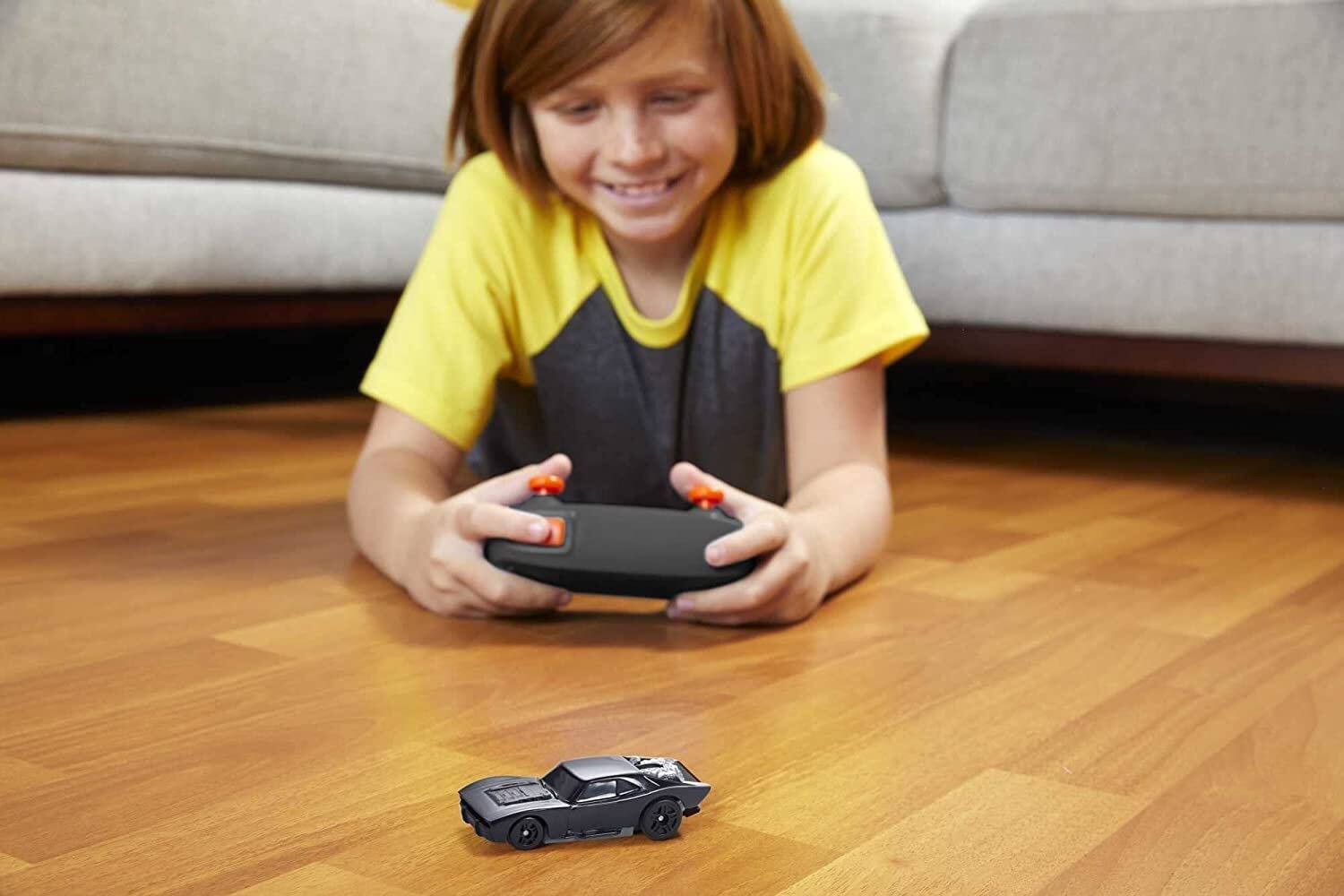 Left. Hot Wheels - Hot Wheels  1:64 Scale RC The Batman Batmobile, USB-Rechargeable Remote Control Car for On- or Off-Track Racing - Black.