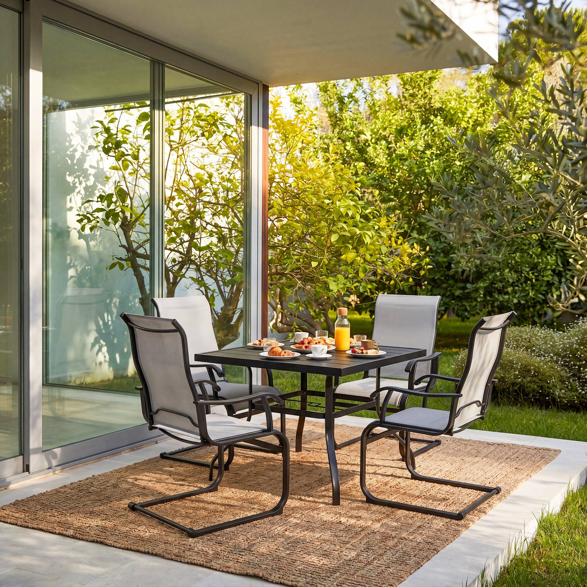 Angle. Nuu Garden - 5-Piece Patio Dining Set, Textilene Chairs with C-Spring Legs - Black and Gray.