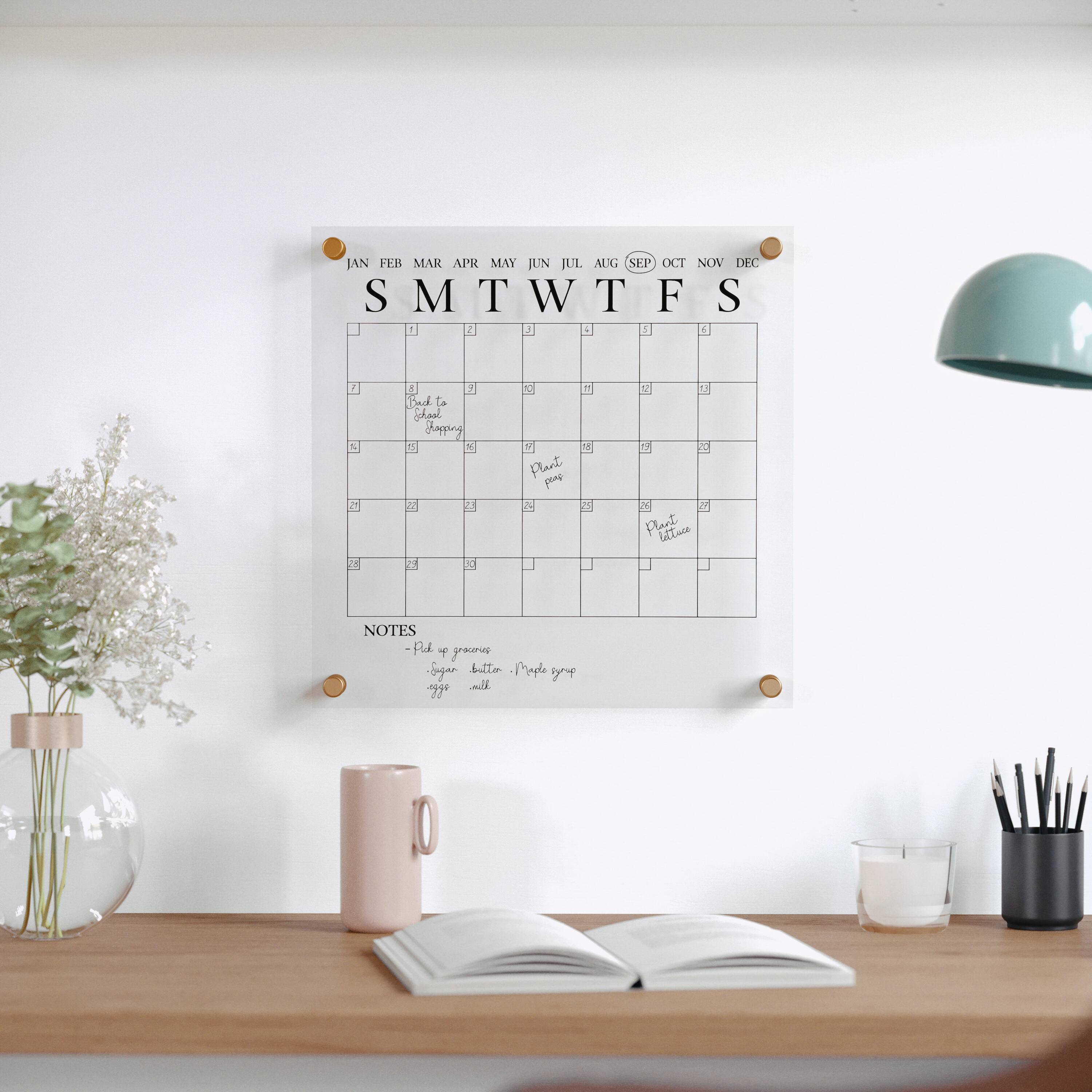 The text on the image reads: "JAN FEB MAR APR MAY JUN JUL AUG SEP OCT NOV DEC SMTWTFS". This is a calendar that shows the months of the year, including January, February, March, April, May, June, July, August, September, October, November, and December. The calendar also has notes written on it, indicating that it is being used for planning and organization purposes.