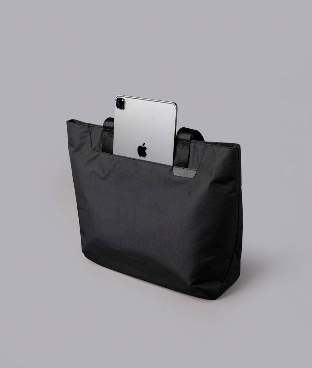 Alt View 4. ALPAKA - Elements Tote 20L Laptop Tote Bag with Padded 16" Sleeve,Open Top with Magnetic Closure - Black Axoflux 210D.