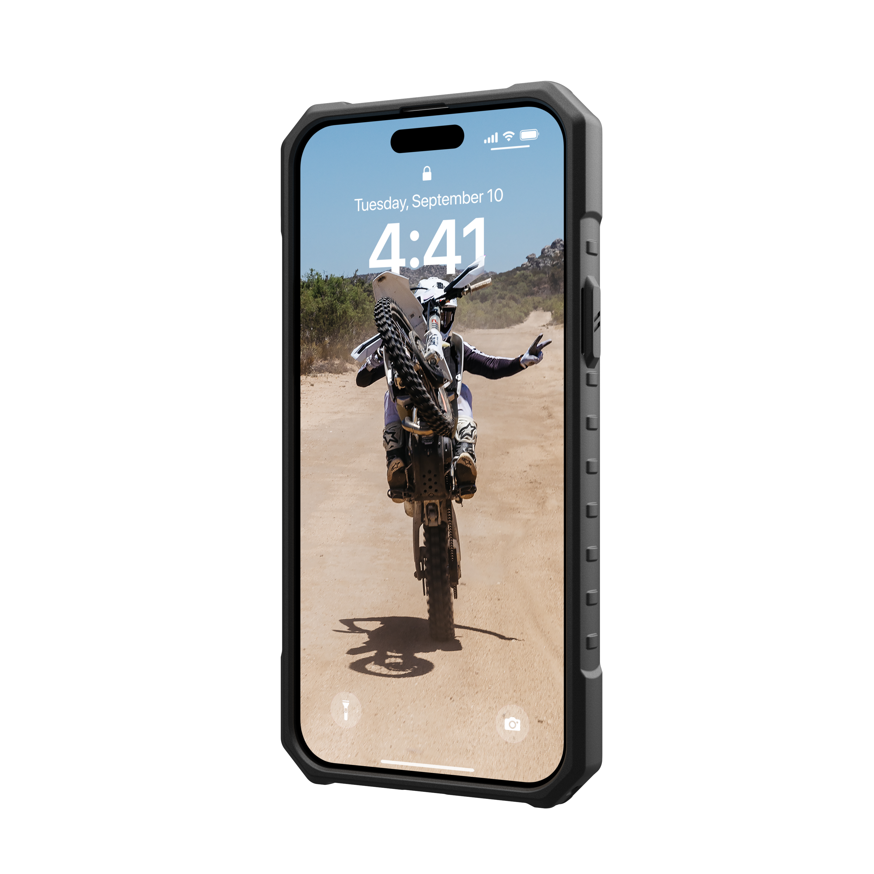 The image shows a cell phone displaying a picture of a person riding a dirt bike. The time displayed on the phone is 4:41.