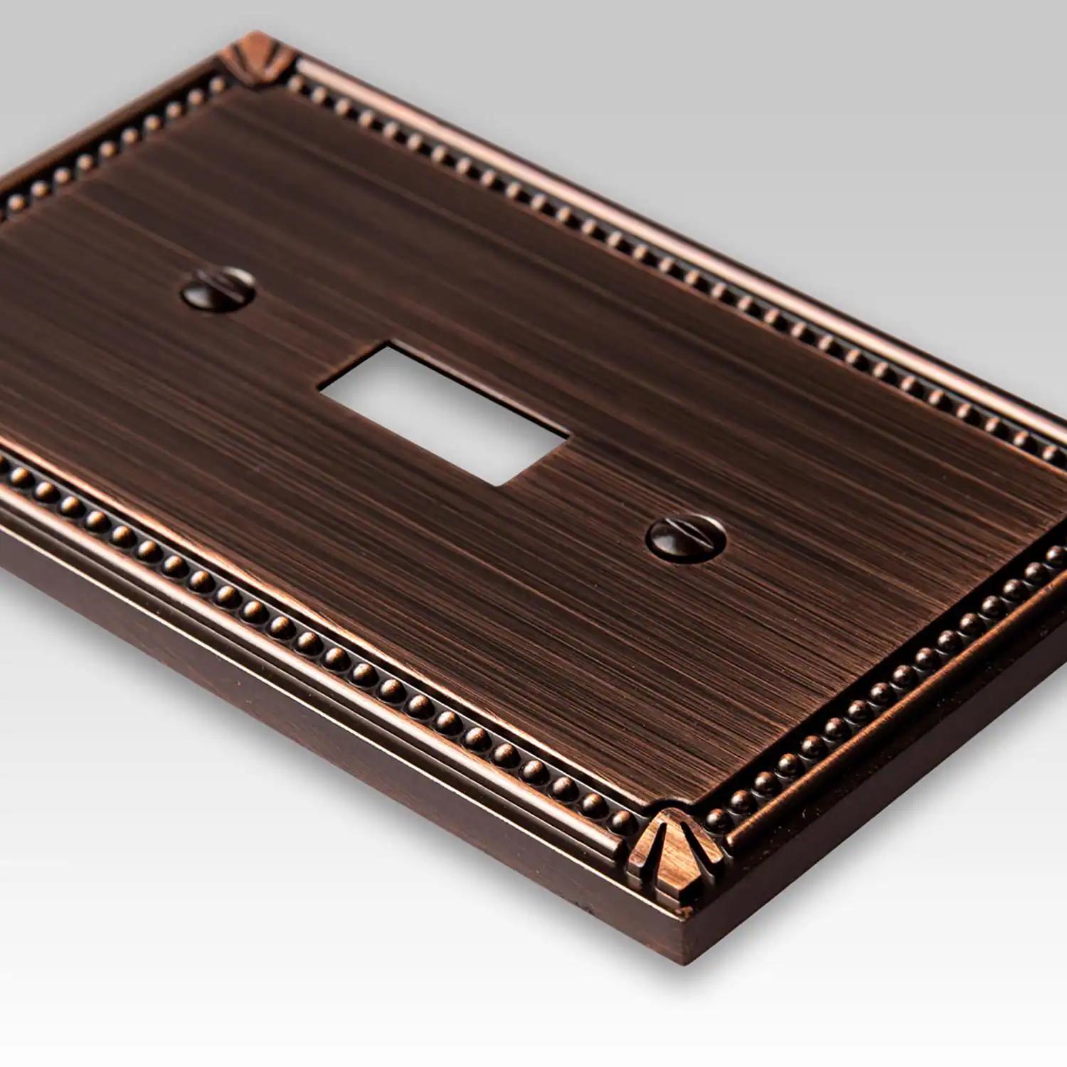 Left. AMERELLE - Amerelle Imperial Bead Aged Bronze 1 gang Die-Cast Metal Toggle Wall Plate 1 pk - Bronze.