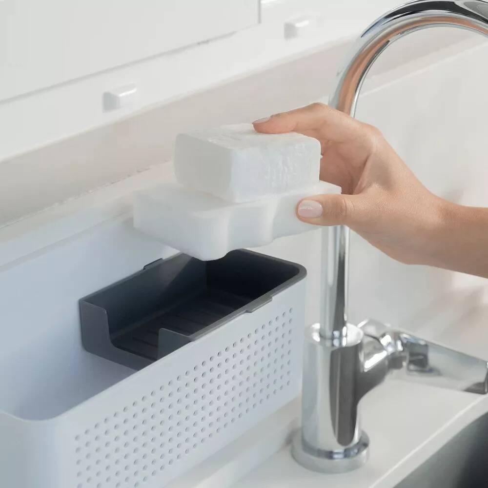 Left. OU - Hanging Sink Organizer, Self‑Adhesive Caddy with Removable Sponge Tray for Kitchen Storage - White.