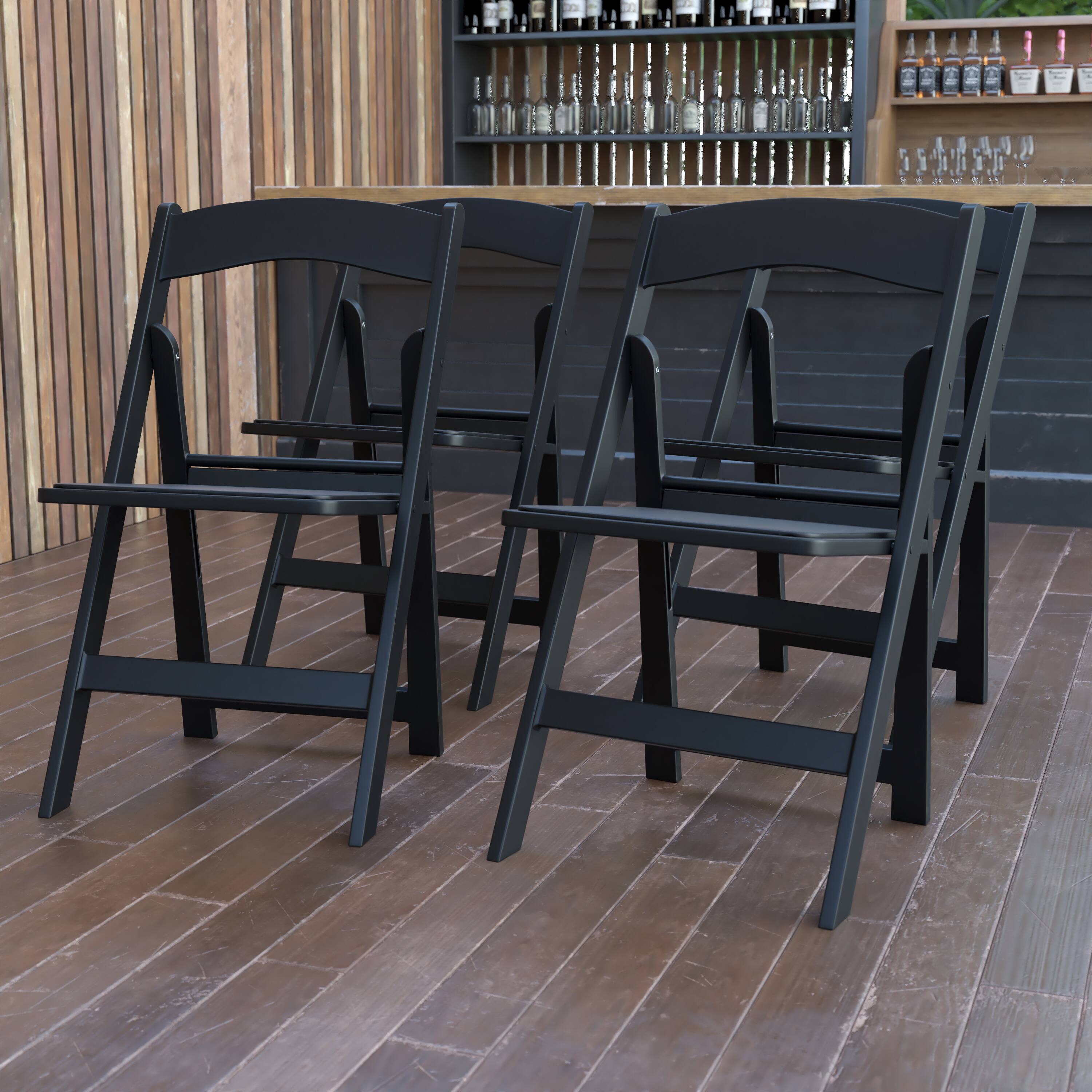 Alt View 2. Emma + Oliver - Set of 4 800 lb Weight Capacity Indoor/Outdoor Resin Folding Chairs - Black.