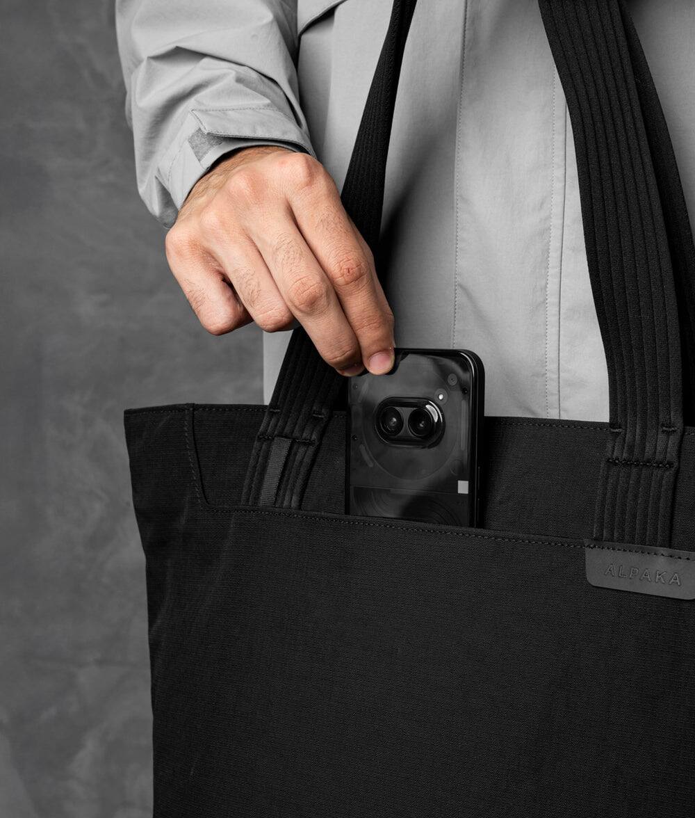 Left. ALPAKA - Flight Tote (M) Laptop Tote Bag for Work, Tote Bag Fits 14" MacBook Pro, Water Bottle Pocket, Luggage Pass-Through - Black Axoflux 400D.