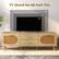 The text on the image reads "TV Stand for 65-Inch TVs 65" 55" 40". This text is grouped and corrected as follows:
"TV Stand for 65-Inch TVs: 65" x 55" x 40"."