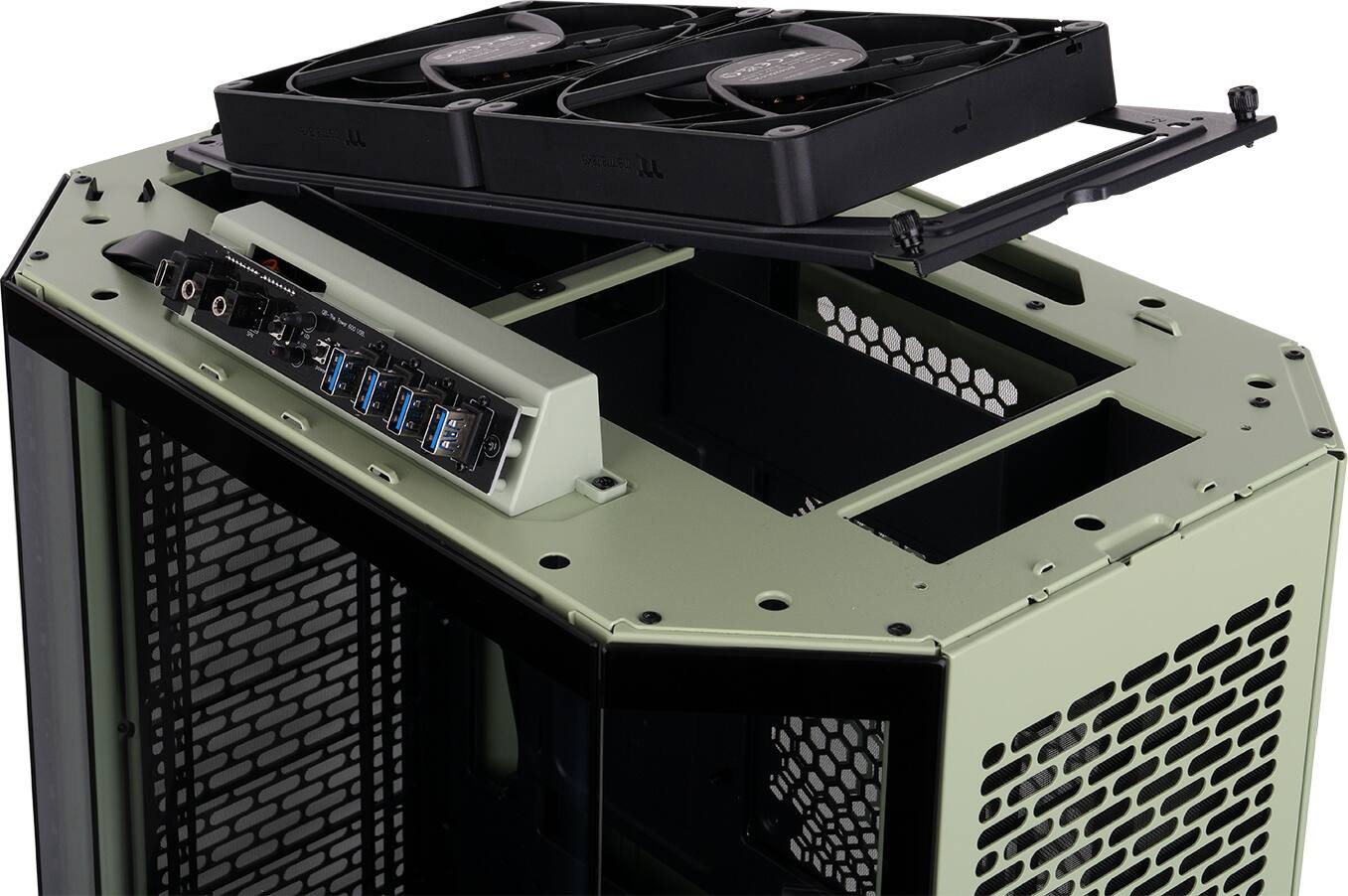 We have a large black computer tower with a green case. The tower has a fan on top and a power supply unit on the side. The case is open, revealing the internal components of the computer.