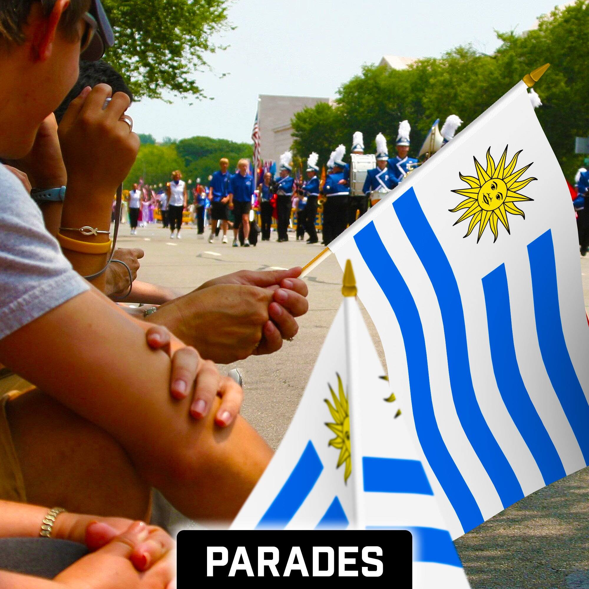 Alt View 1. G128 - 12 Pack Handheld Uruguay Stick Flags, 12" x 18", 150D Polyester with Wooden Pole and Gold Spear Tip. - Assorted Colors.