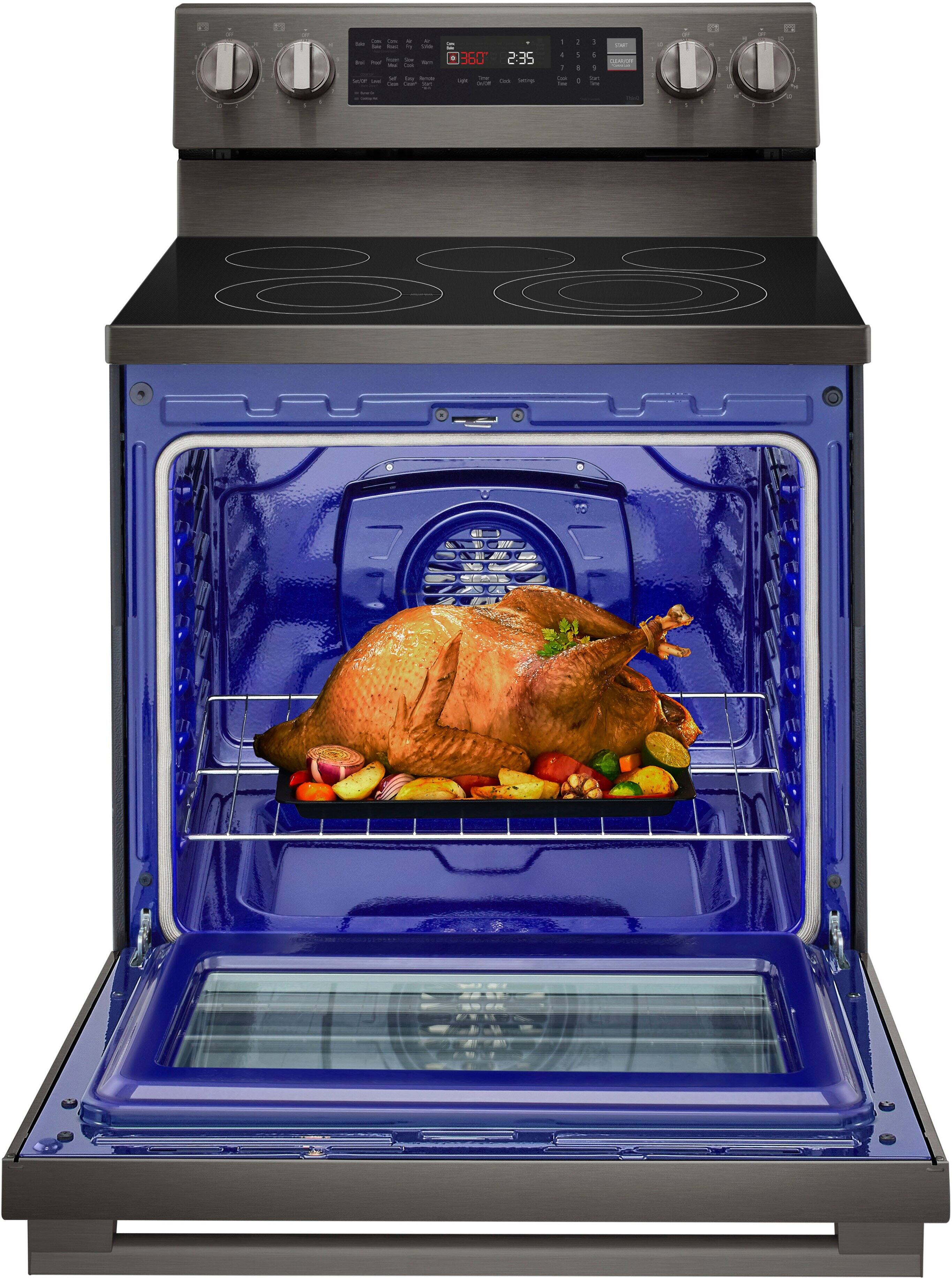 The image shows a blue oven with a turkey inside, placed on a rack. The oven is set to 360 degrees Fahrenheit and the timer is set for 2:35. The turkey is surrounded by various vegetables, including carrots and potatoes, which are arranged around it. The oven is open, revealing the delicious meal being cooked inside.