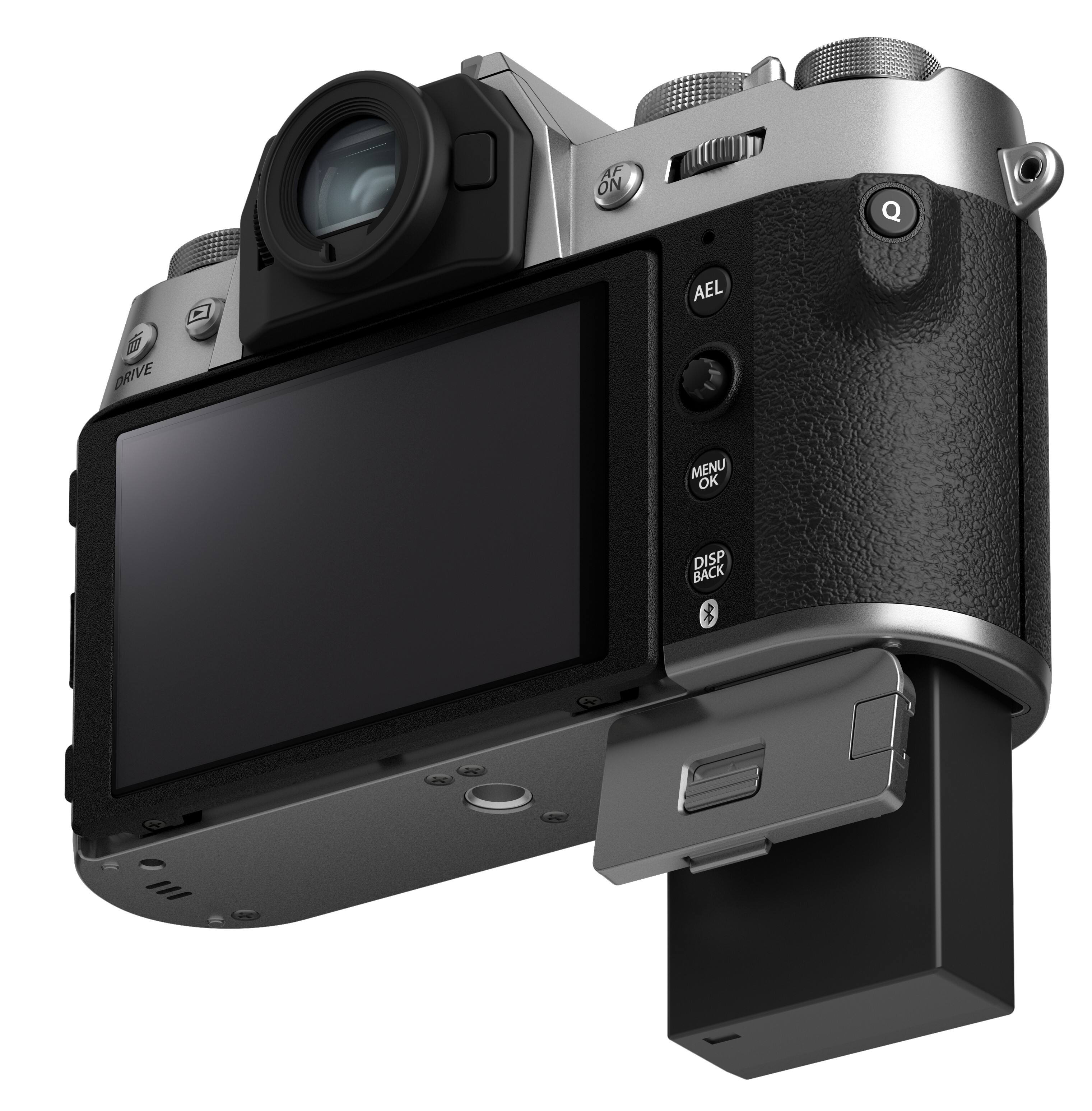 The image is of a digital camera with a large screen. The camera has a viewfinder and a screen on the back. The camera also has a flash and a memory card slot. The camera is designed for taking pictures and recording videos.