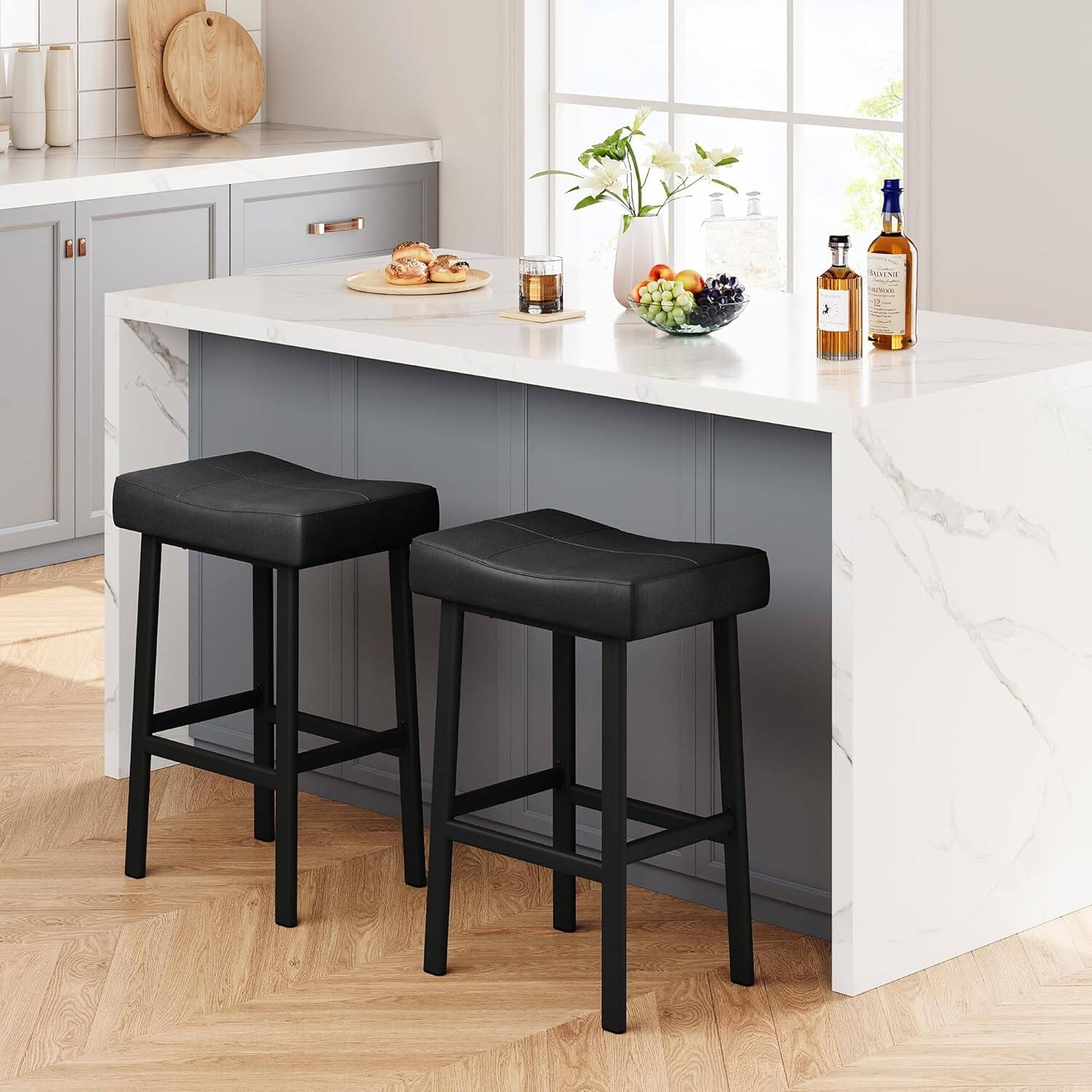 Angle. GARVEE - 24 Inch Backless Saddle Barstools Set of 2, Counter Height Upholstered Padded Barstools with Curved Surface, Black - Black.