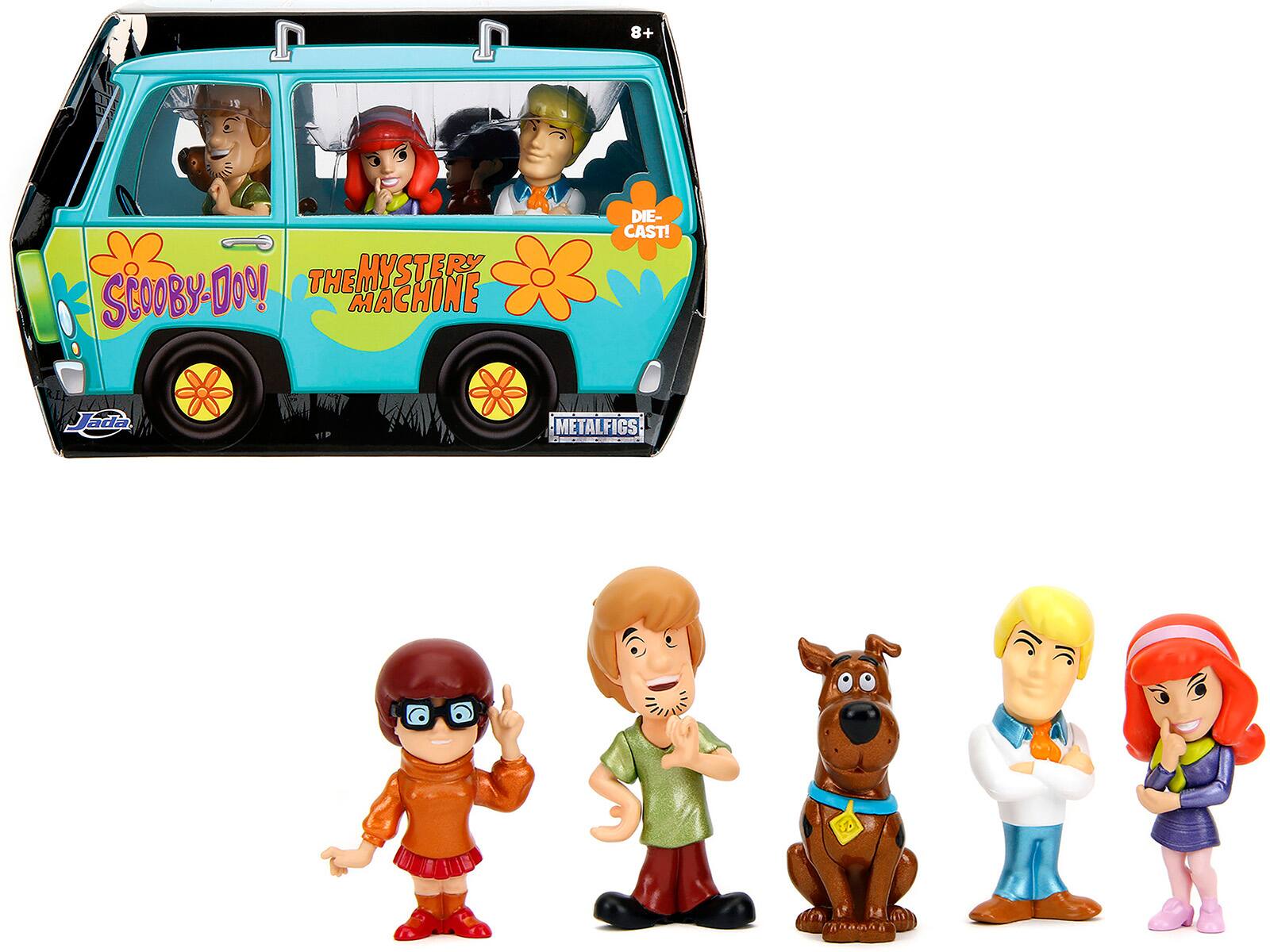 Sure, here is the corrected and grouped text from the image:

---

**Top Left:**
- "8+"

**Top Center:**
- "THE MYSTERY MACHINE"

**Top Right:**
- "DIE-CAST!"

**Middle Left:**
- "SCOOBY-DOO!"

**Middle Right:**
- "METALFIGS"

**Bottom Left:**
- "Jada"

**Bottom Right:**
- "VIP"

---