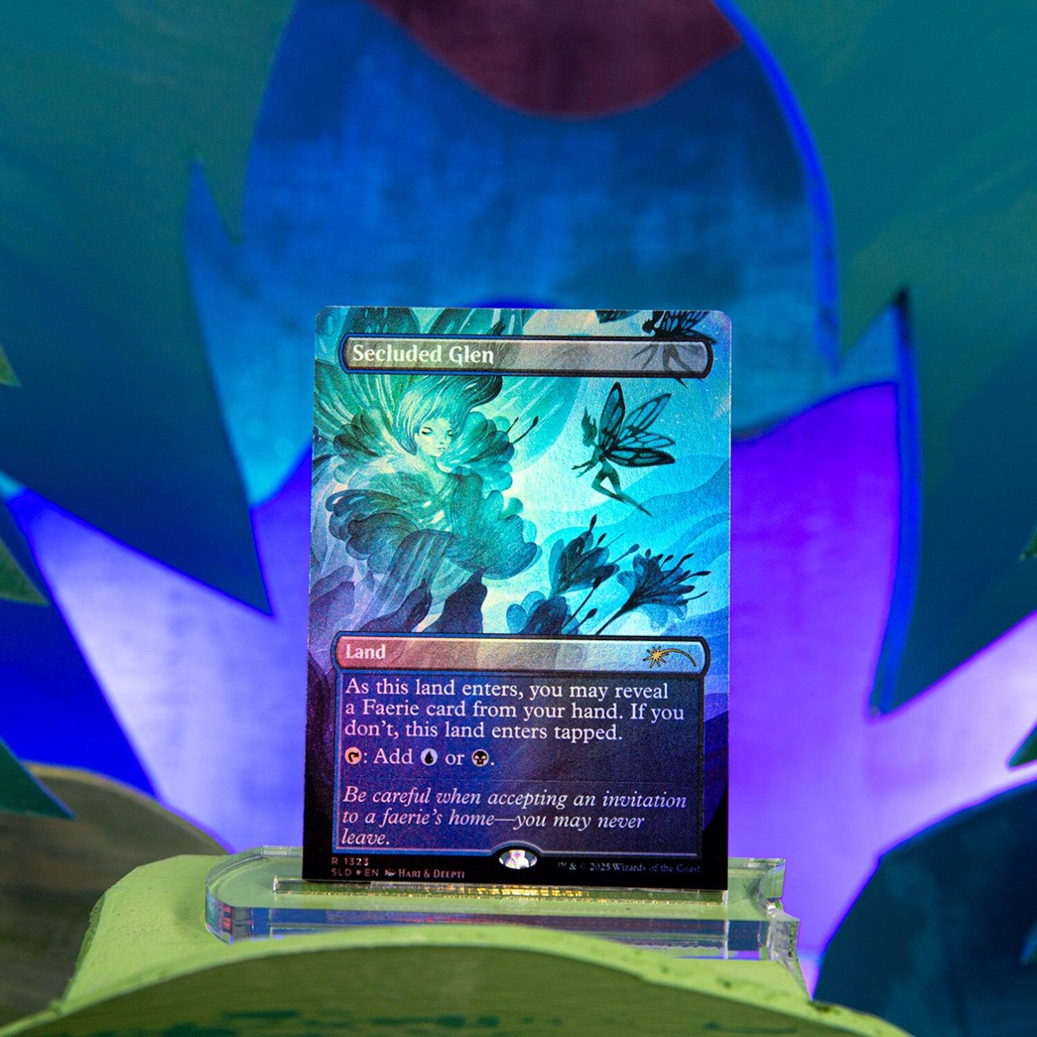 Secluded Glen  
Land  

As this land enters, you may reveal a Faerie card from your hand. If you don't, this land enters tapped.  
• Add or .  

Be careful when accepting an invitation to a faerie's home—you may never leave.  

1375 2125  
Wizards of the Coast  
LD EN  
HARI & DELPTI