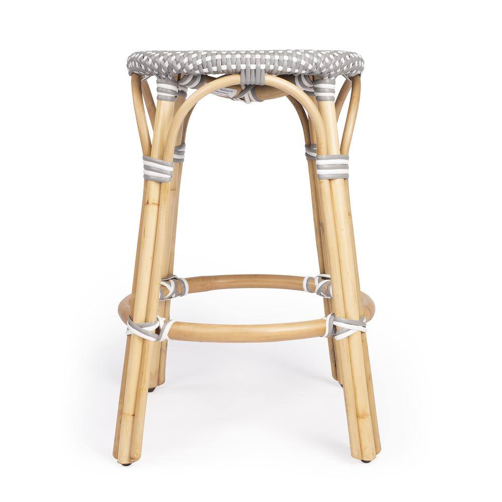 Back. Butler Specialty - Tobias Rattan Round 24" Counter Stool - Gray And White Dot.