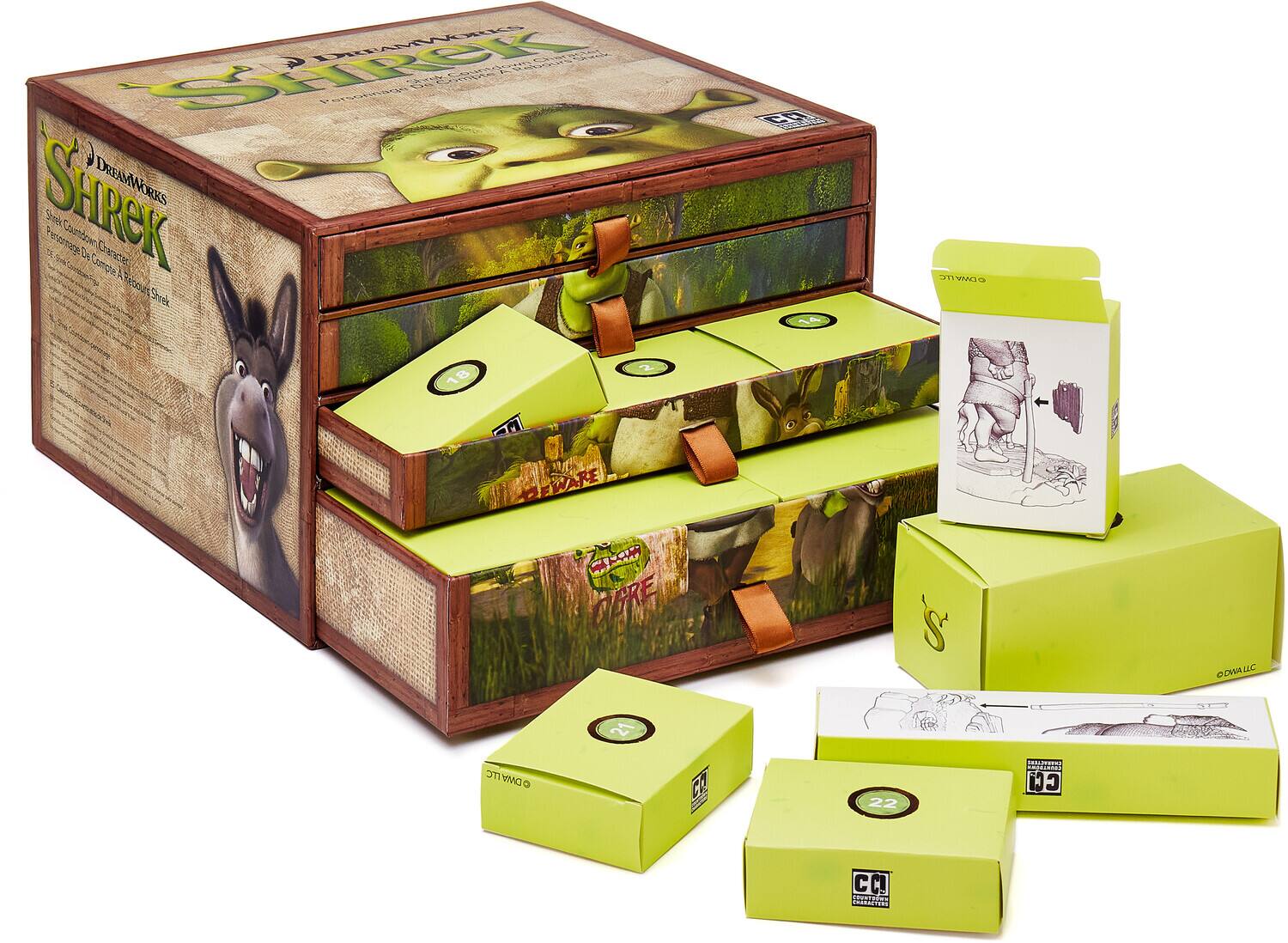 The text in the image is:

"SHREK
DREAMWORKS
Shrek Character Collection
Shrek 2002
Shrek 18
Donkey
Pig
Fiona
21
Ogre
22
Cirque du Soleil"

Corrected and grouped:

"SHREK
DREAMWORKS
Shrek Character Collection
Shrek 2002
Shrek 18
Donkey
Pig
Fiona
21
Ogre
22
Cirque du Soleil"