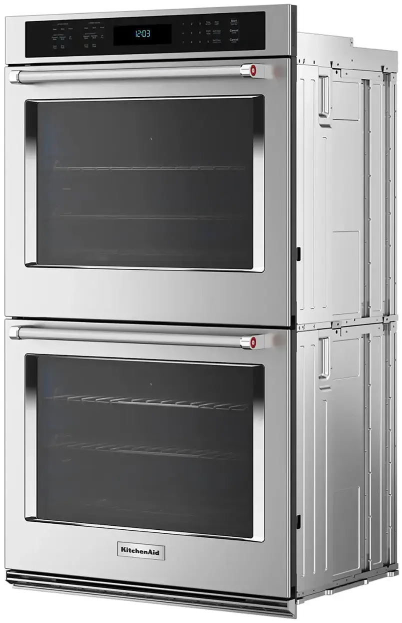 The text on the image reads "12:03 - Carcal O 0 KitchenAid." This can be grouped and corrected as follows:

"12:03 - Carcal O 0 KitchenAid" can be grouped as a single sentence. The correct sentence would be: "The time on the oven is 12:03, and it is a KitchenAid model."