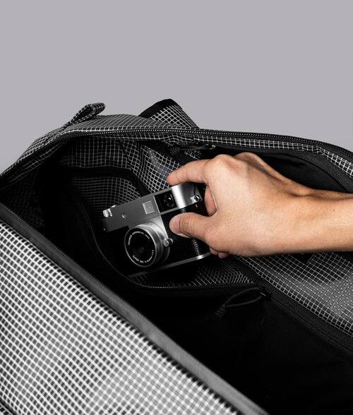Alt View 4. ALPAKA - 35L Lightweight Duffel Bag for Gym, Weekend Trips & Carry-On Travel, Momentum Duffel, Weather-Resistant - Axodyne hybrid Grey.