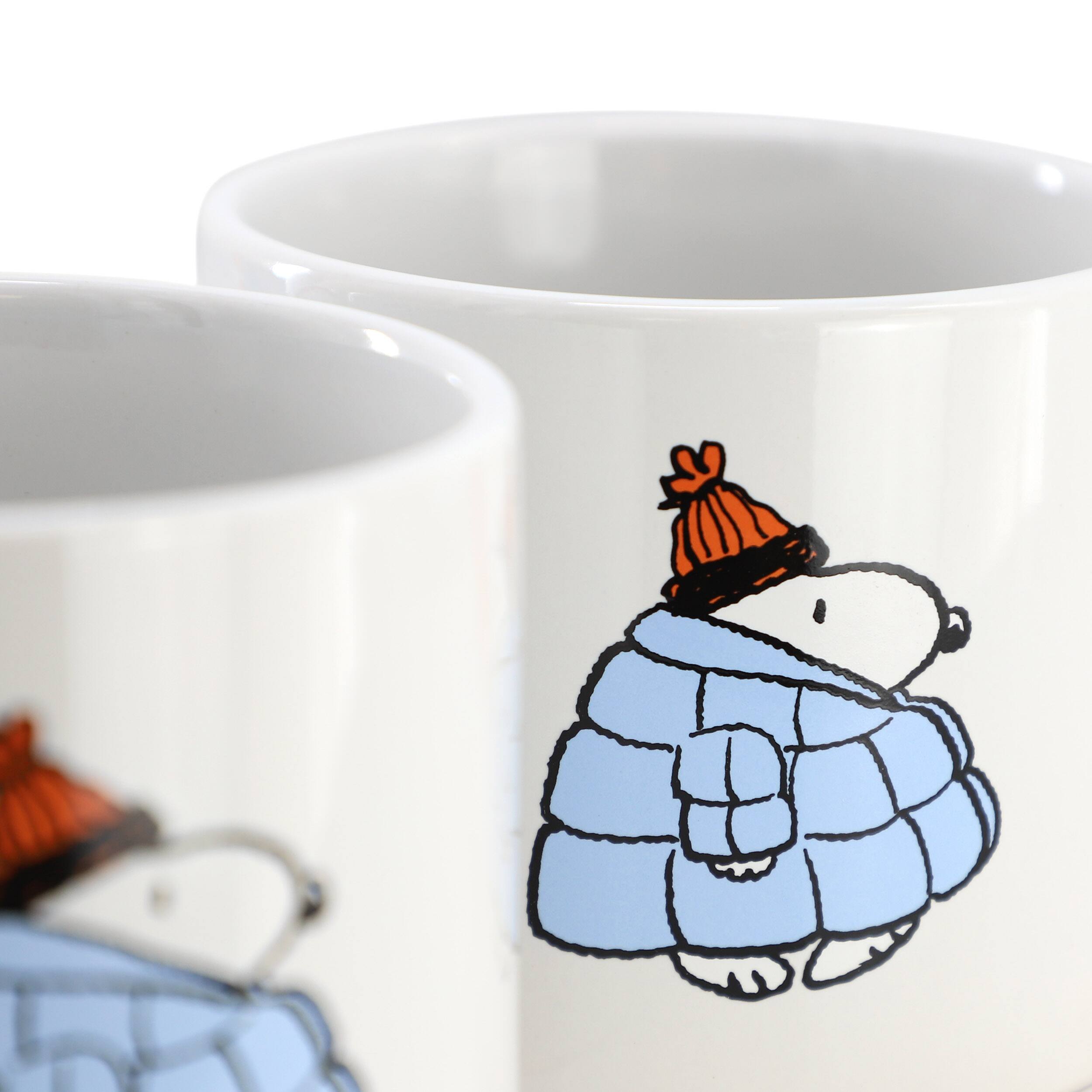 Angle. Peanuts - Peanuts All Bundled Up 4 Piece 19 Ounce Stackable Stoneware Mug Set in Peach - $34.99.