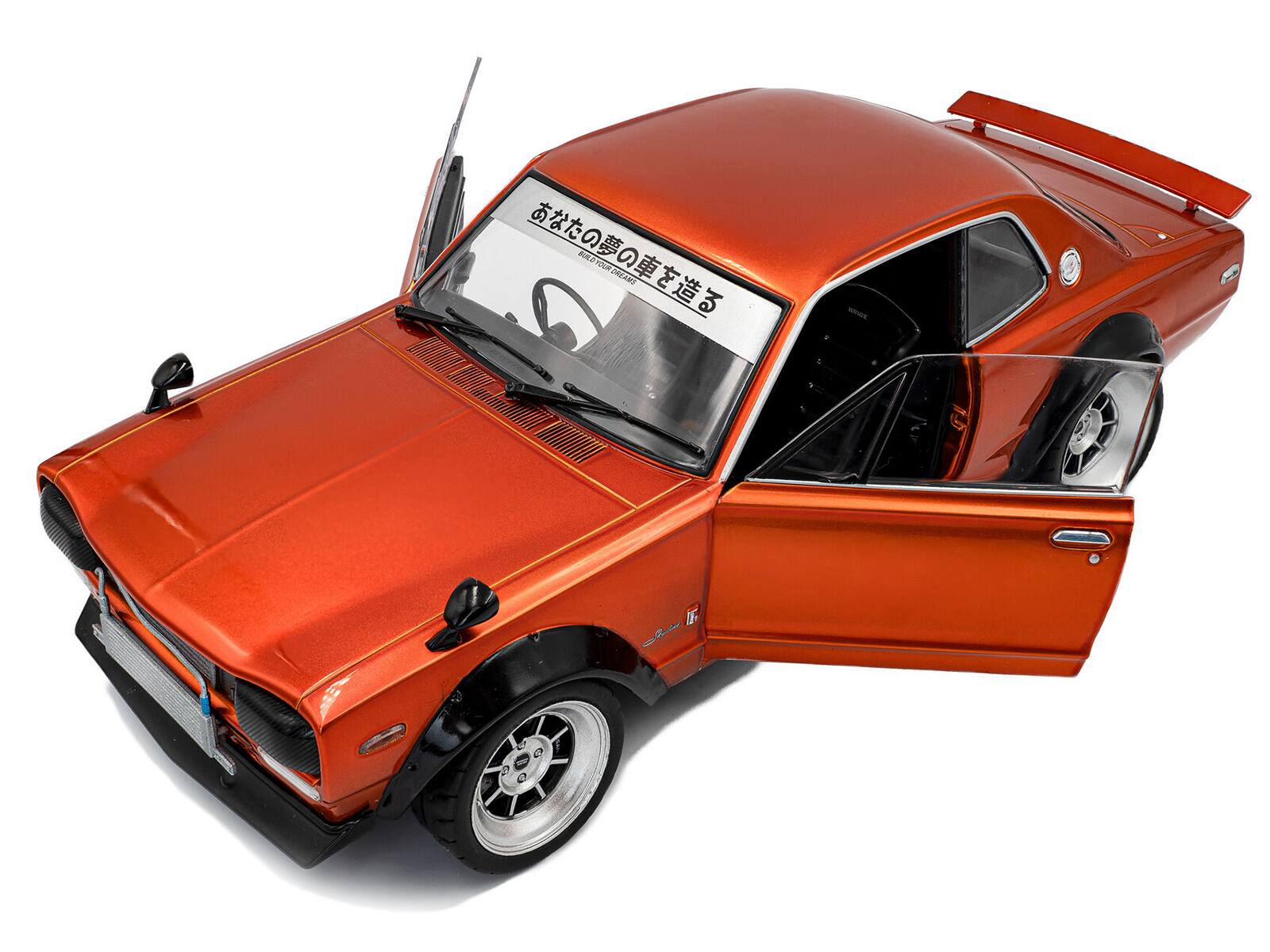 Alt View 1. Solido - 1970 Nissan Skyline (C10) Hakosuka RHD (Right Hand Drive) Orange Metallic 1/18 Diecast Model Car by Solido.
