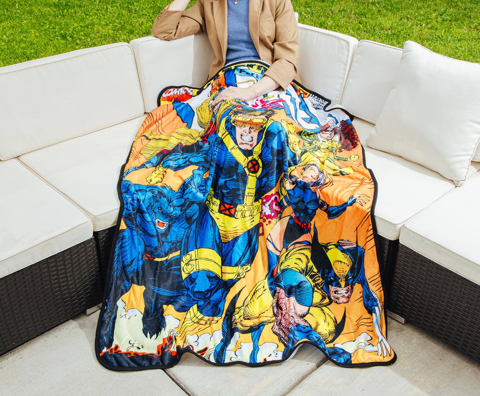 The text on the blanket reads:

"OMICS"