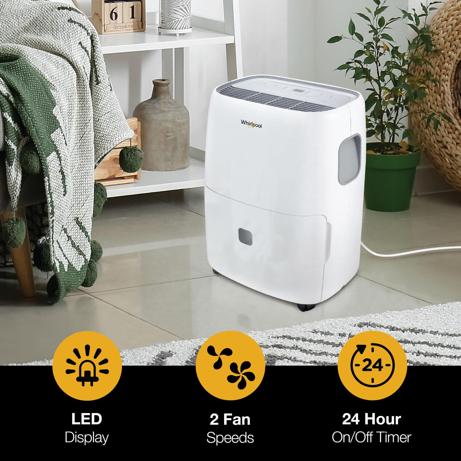 The image features a white Whirlpool air conditioner with a 24-hour on/off timer. The appliance has a 24 LED display and two fan speeds. The air conditioner is placed on a tile floor, and there are several potted plants nearby. The scene also includes a chair and a vase, adding to the overall ambiance of the room.