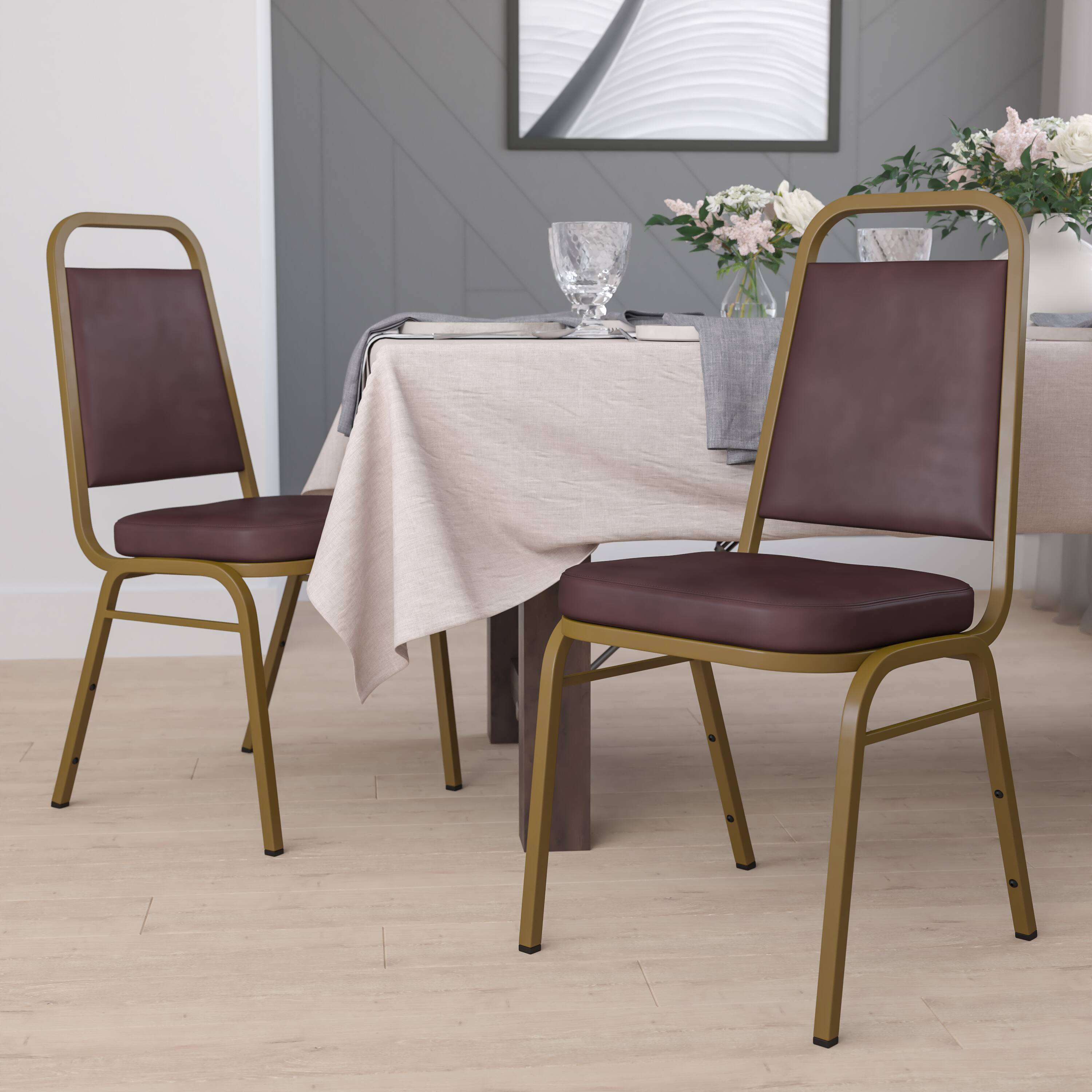 Alt View 1. Emma + Oliver - 4 Pack Trapezoidal Back Stacking Banquet Chair - Brown Vinyl/Gold Frame.