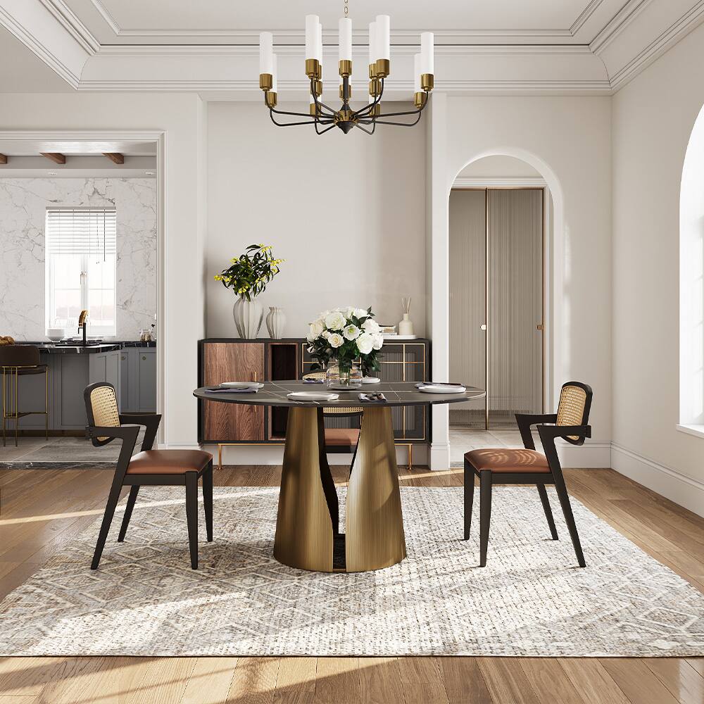 Angle. POVISON - 47" Modern Black Round Dining Table for 4, Matte Sintered Stone Tabletop, Bronze Carbon Steel Base - Matte Black Sintered Stone & Bronze Steel Base.