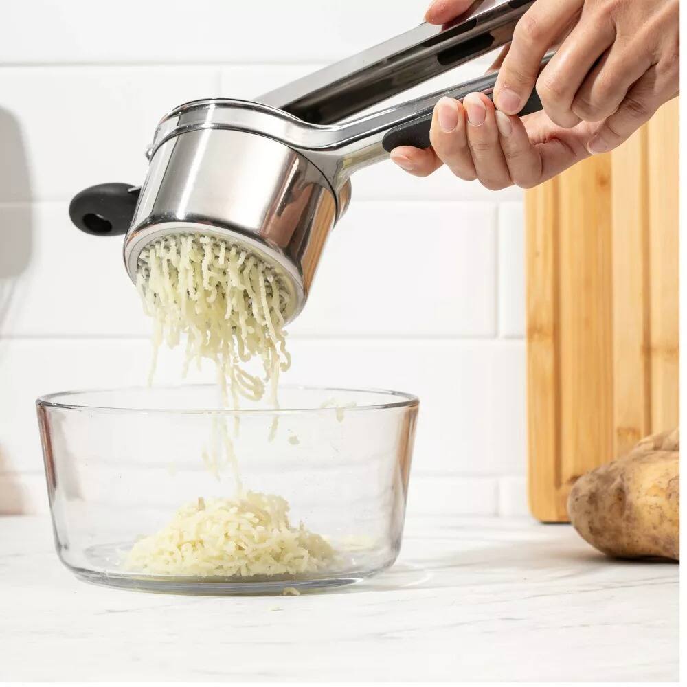 Angle. Luminuxe - 15oz Potato Ricer, Heavy Duty Stainless Steel Potato Masher and Ricer, Nonslip Handle.