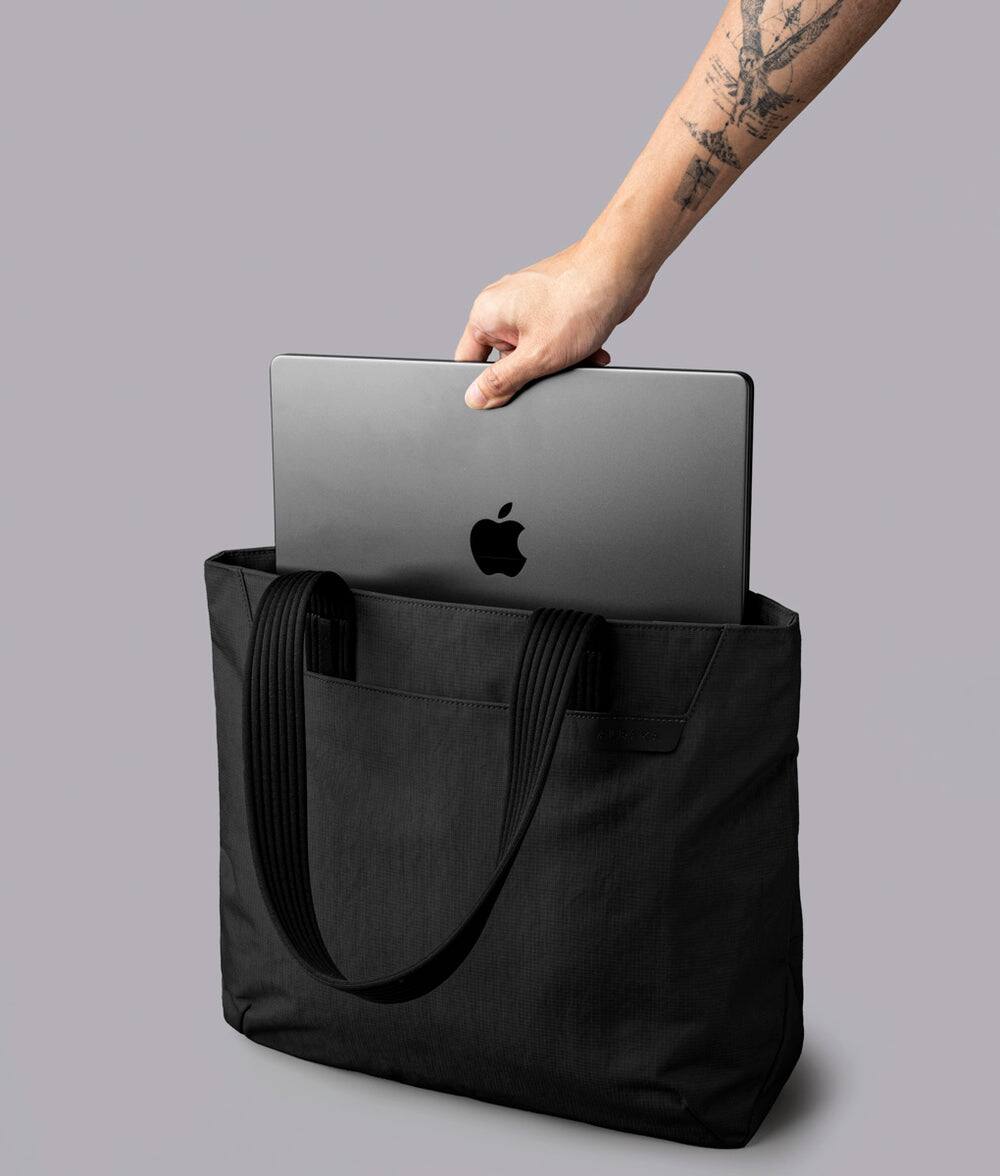 Alt View 6. ALPAKA - Flight Tote (M) Laptop Tote Bag for Work, Tote Bag Fits 14" MacBook Pro, Water Bottle Pocket, Luggage Pass-Through - Black Axoflux 400D.