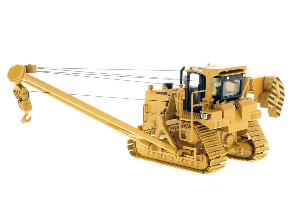 Left. Diecast Masters - CAT Caterpillar 587T Pipelayer with Operator "Core Classics" Series 1/50 Diecast Model by Diecast Masters - Yellow .