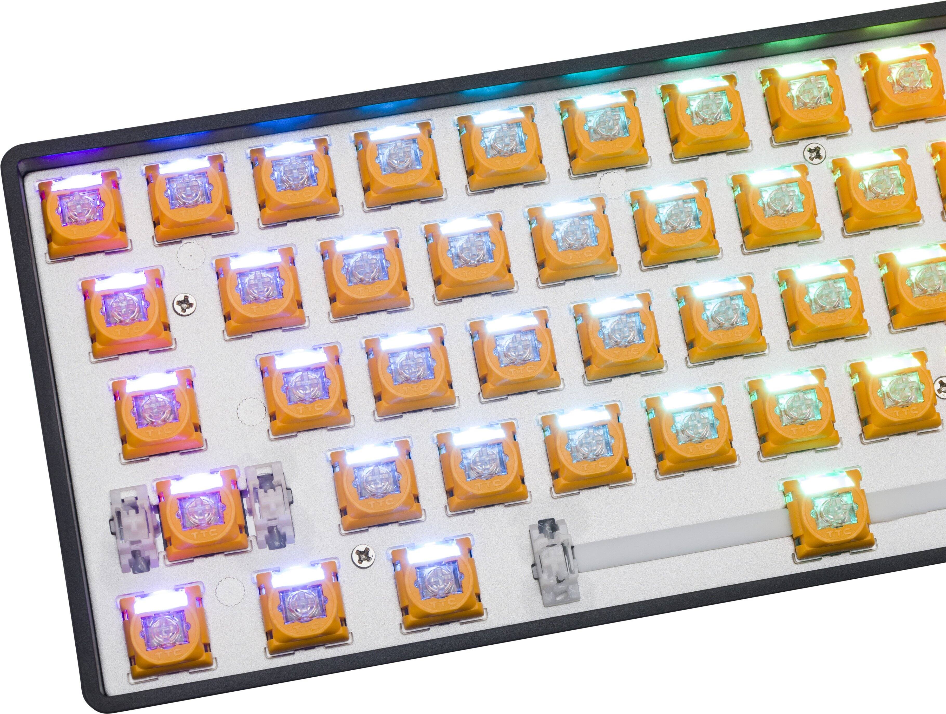 The image shows a close-up of a keyboard with a row of yellow and blue lights. The keyboard has a total of 12 keys, and the lights are arranged in a neat row. The lights are illuminated, creating a visually appealing and colorful display. The keyboard is likely designed for use in a computer or gaming setup, offering a unique and engaging experience for the user.