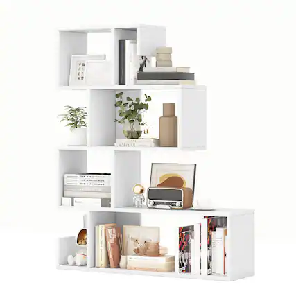 The image features a white bookshelf filled with various items. On the shelves, there are several books, a vase, a potted plant, a clock, and a cup. The bookshelf is arranged in a way that maximizes the available space, with the books placed in different positions and orientations. The combination of these items creates a visually appealing and functional display.