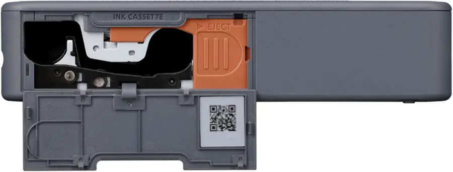 The text on the image reads "INK CASSETTE EJECT >PC+ABS< B." This text is likely related to the printer cartridge and its compatibility with different materials.