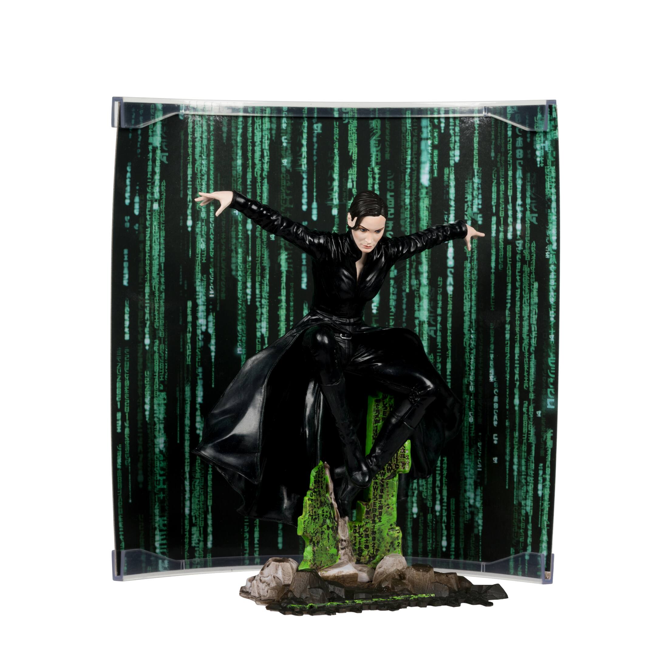 The image features a woman in a black dress and black boots, standing on a green rock. She appears to be posing for a picture. The background is decorated with a green curtain and a green wall. The woman's outfit and the green elements in the scene create a visually striking and unique image.