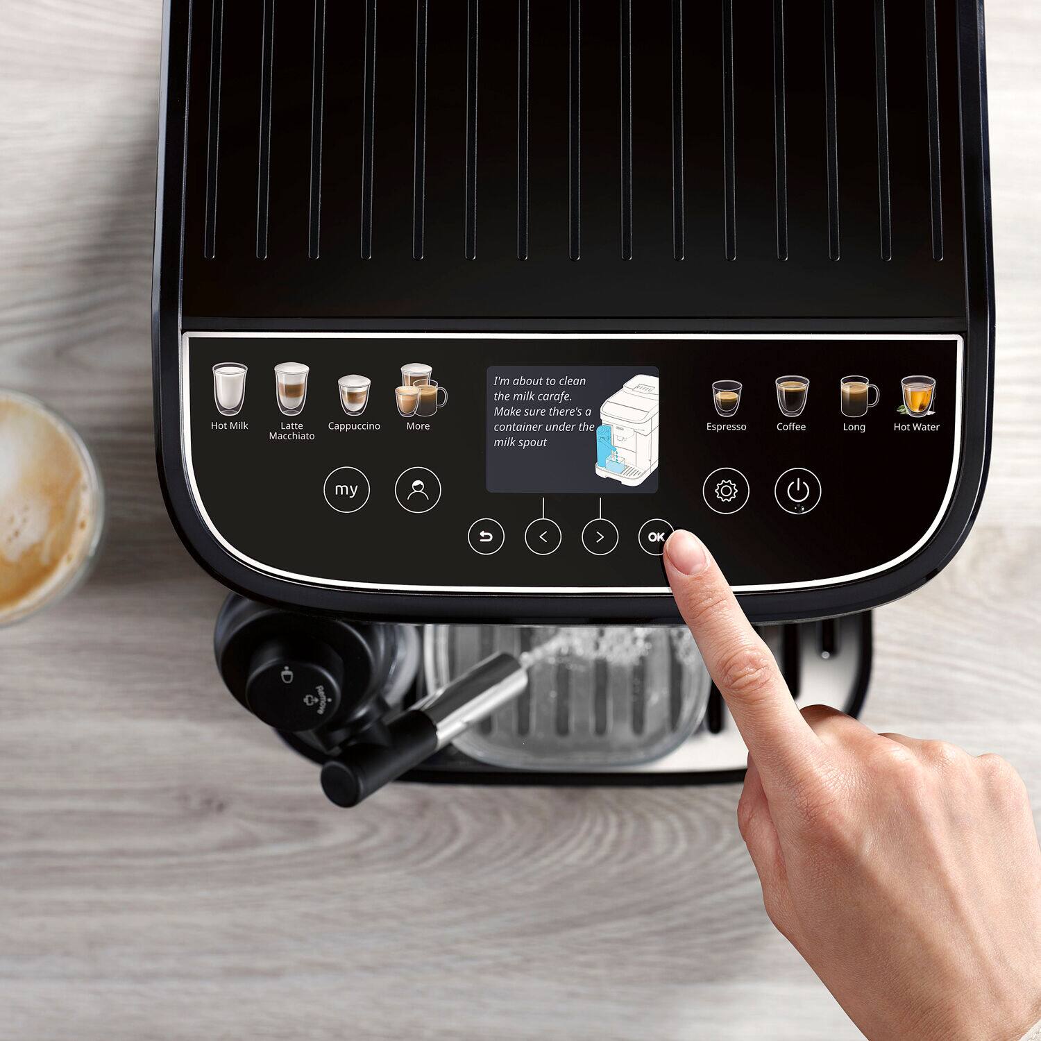 Hot Milk  
Latte Macchiato  
Cappuccino  
More  

I'm about to clean the milk carafe. Make sure there's a container under the milk spout  

Espresso  
Coffee  
Long  
Hot Water  

my  
OK