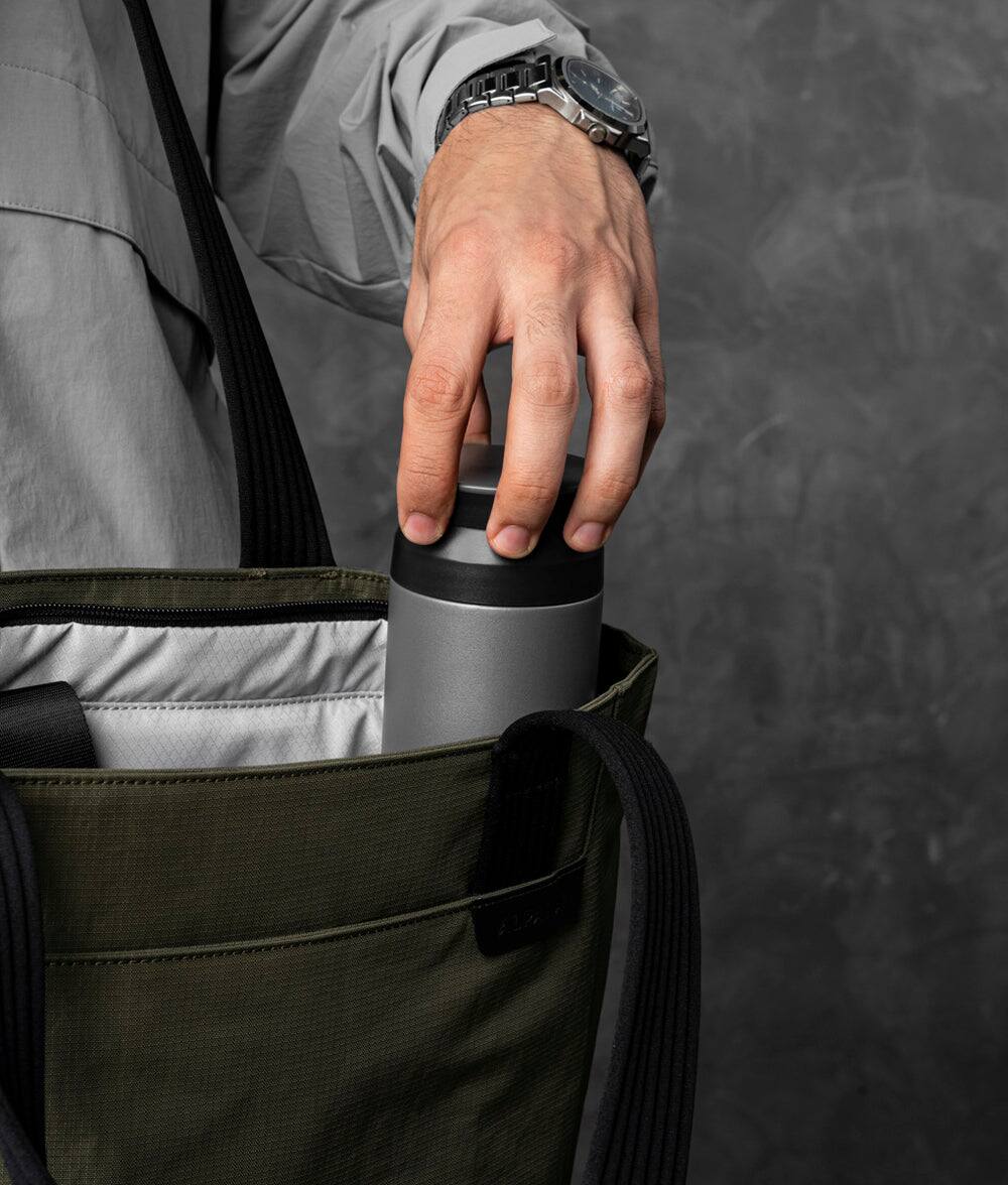 Alt View 2. ALPAKA - Flight Tote (L) Laptop Tote Bag for Work, Large Tote Bag Fits 16" MacBook Pro, Water Bottle Pocket, Luggage Pass-Through - Green Axoflux 400D.