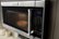 Alt View Zoom 22. Amana - 1.6 Cu. Ft. Over-the-Range Microwave - Black on stainless steel.